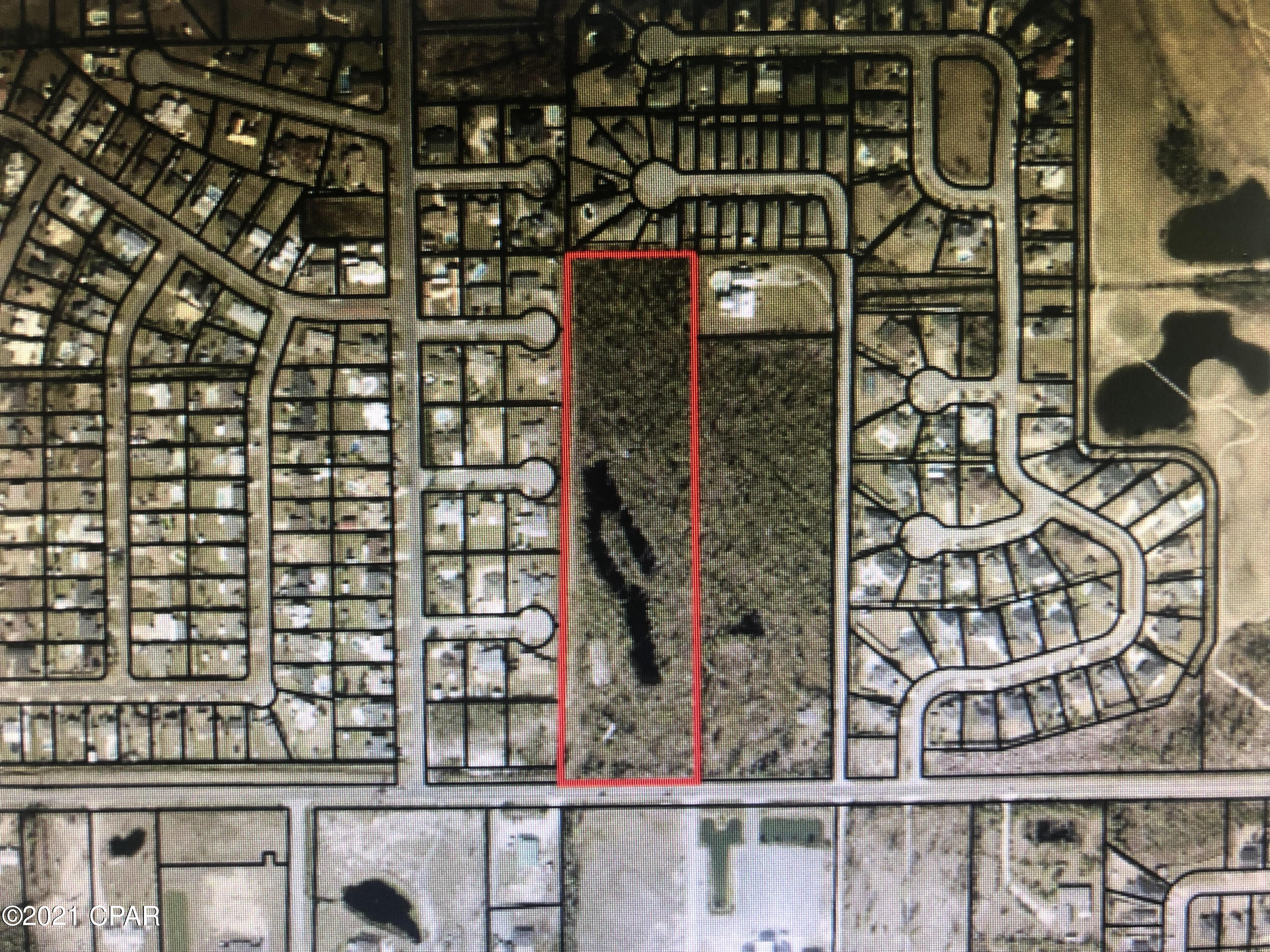 This 9.4+ acre parcel located in unincoporated Bay County is in a prime location and ready for development.  The potential here can go numerous different ways.  The owner had surveys, engineering work, potential plat designs done in the past.  There is a letter on file from DEP stating the pond is not located in State waters and so can be filled and does not require permitting from DEP.  The potential plat layout shows a simple cul-de-sac street with either 38 65'x140' lots or 25 100'x140' lots.   Come walk this property today and get ready for your next project!  There is much upside to be had here.  See attached documents for prior engineering work.