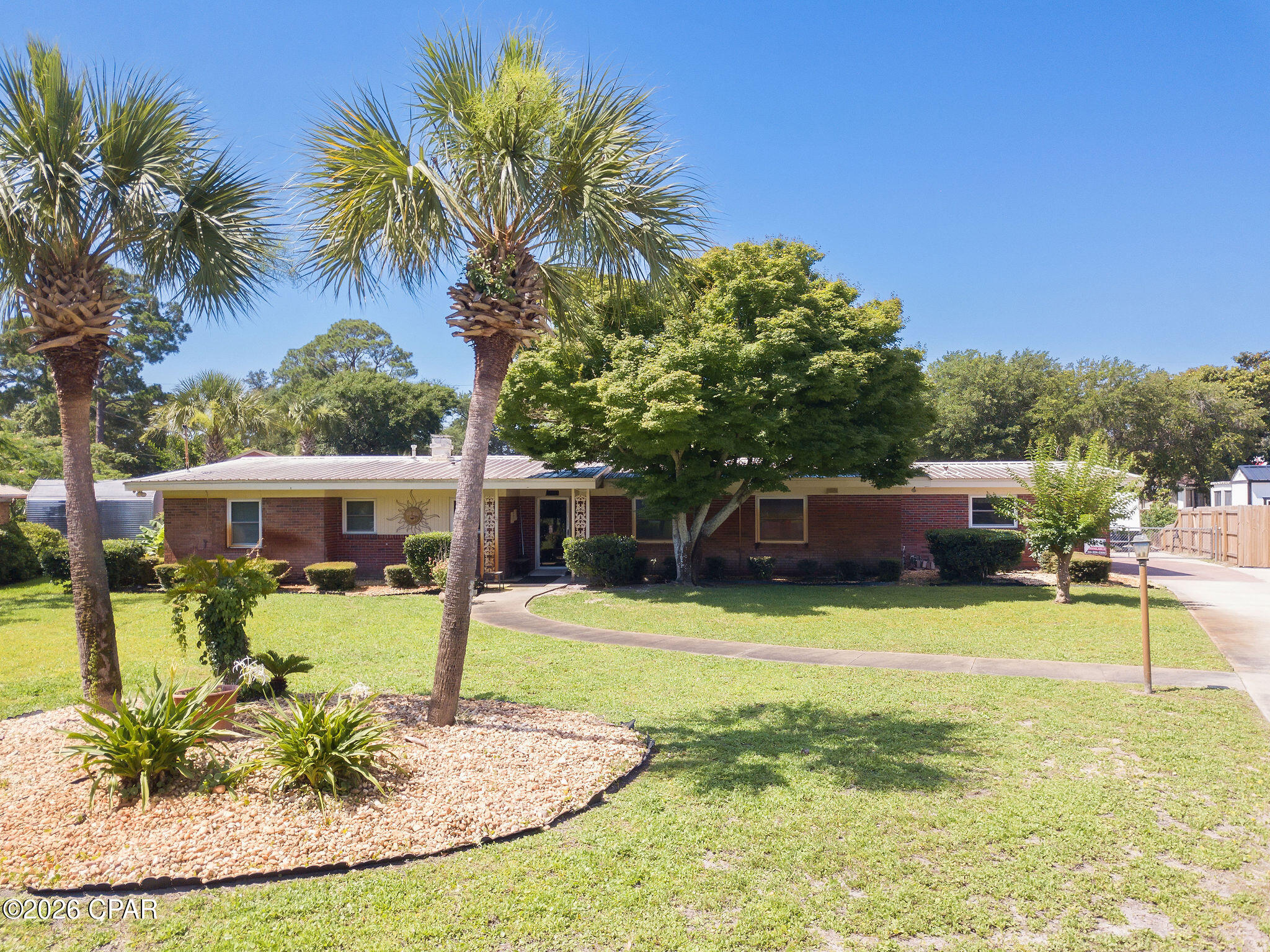 ***PHOTOS COMING SOON***

Rare opportunity to own a waterfront home in the historic Woodlawn community, one of Panama City Beach's earliest planned neighborhoods. This charming 1958 canal-front residence offers the perfect blend of Old Florida character, boating convenience, and an unbeatable location with no HOA.

Situated on a wide canal with approximately 191 feet of seawall frontage, this property is a boater's dream. Enjoy direct access to St. Andrews Bay and the Gulf of Mexico from a canal averaging 5-6 feet deep at center and approximately 80 feet wide, providing excellent maneuverability for larger vessels. The private dock is equipped with an I-beam boat lift capable of accommodating boats up to 30 feet in length, making it easy to get on the water at a moment's notice.

Inside, the home features 3 bedrooms, 2 full baths, and a convenient half bath near the garage. The Florida room expands the living space and creates an ideal indoor-outdoor transition area for relaxing or entertaining. Additional highlights include a built-in mini bar, a covered outdoor patio, and a built-in BBQ grill with a functioning flue system, creating the perfect setting for waterfront gatherings.

The waterfront lifestyle is what truly sets this property apart. Spend your days fishing from your dock, cruising to Shell Island, exploring St. Andrews Bay, or enjoying some of the area's popular boat-accessible restaurants. Whether it's a morning fishing trip, an afternoon at Shell Island, or a sunset cruise with family and friends, this home offers endless opportunities to enjoy life on the water.

Conveniently located just minutes from the shops, restaurants, and entertainment of Historic St. Andrews and Downtown Panama City, and only a short drive to Pier Park, you'll enjoy the best of both worlds--peaceful waterfront living with easy access to some of the area's most popular destinations.

Waterfront homes with this combination of character, boating amenities, expansive seawall frontage, and prime Panama City Beach location rarely come available. Don't miss your chance to own a piece of coastal Florida history and start living the waterfront lifestyle you've always imagined.