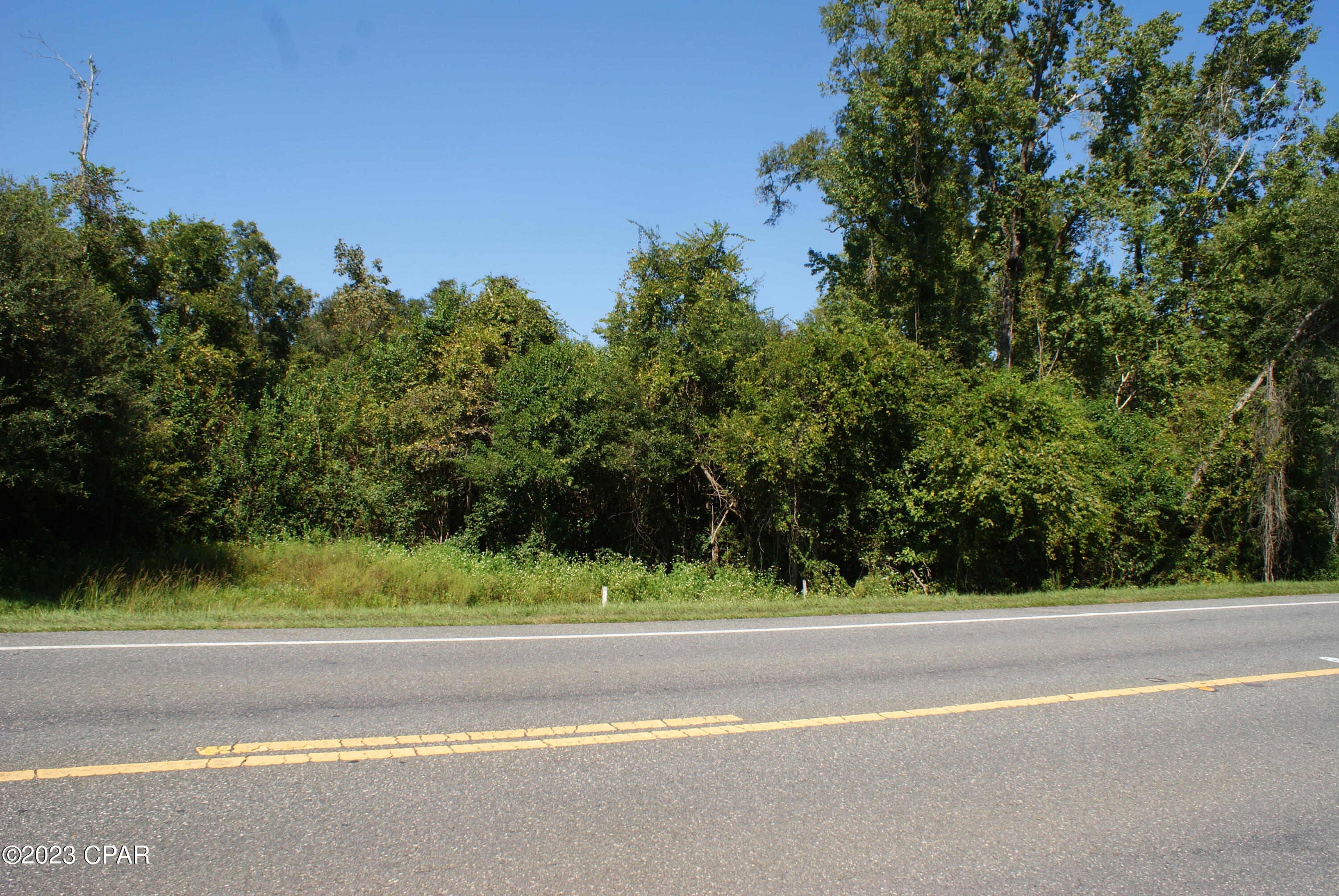 HURRY UP FOR THIS ONE!!! Lovely parcel including 19.45 Total Acres just off of Highway 90 West in Cottondale, Florida. Property includes a stocked fishpond and various stands of trees making it suitable for housing development. Backs up to Cottondale Park and Recreation Area.
