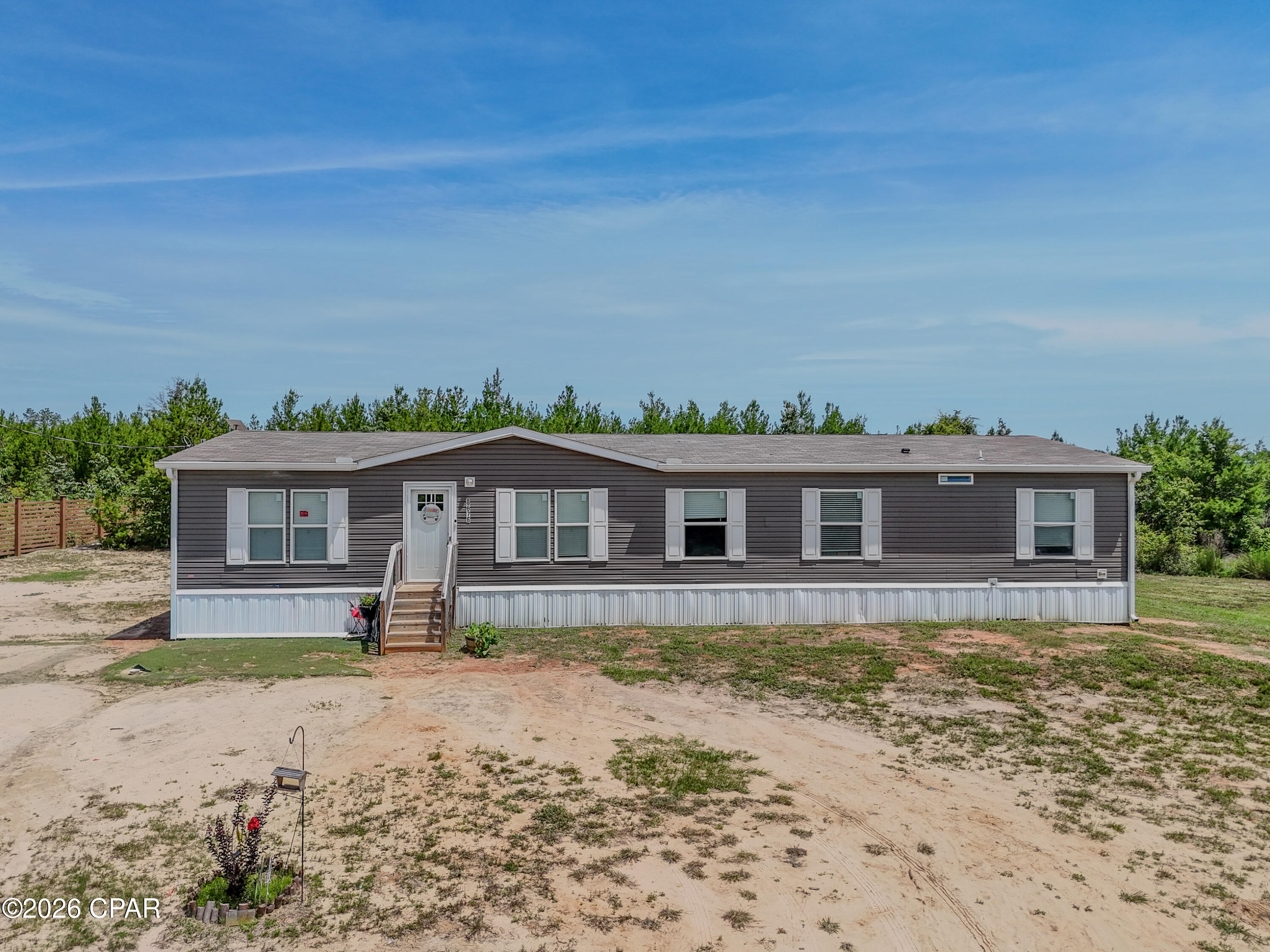 Beautiful 5.6 acres in the country! 2022 DW 4B/2B MH is very spacious. Large walk-in pantry! In addition to the four bedrooms, there is a den/bonus room that could be used for a 5th bedroom or office. Huge nice 12'x32' yard shed equipped with electricity and loft. Property features one cleared acre; the rest is woods for running, playing, and adventure! Entrance to property from the back via NW Felix Flanders Rd., as well as the front. Photos should be loaded Tues. evening June 2nd. Call for your showing Right Now!