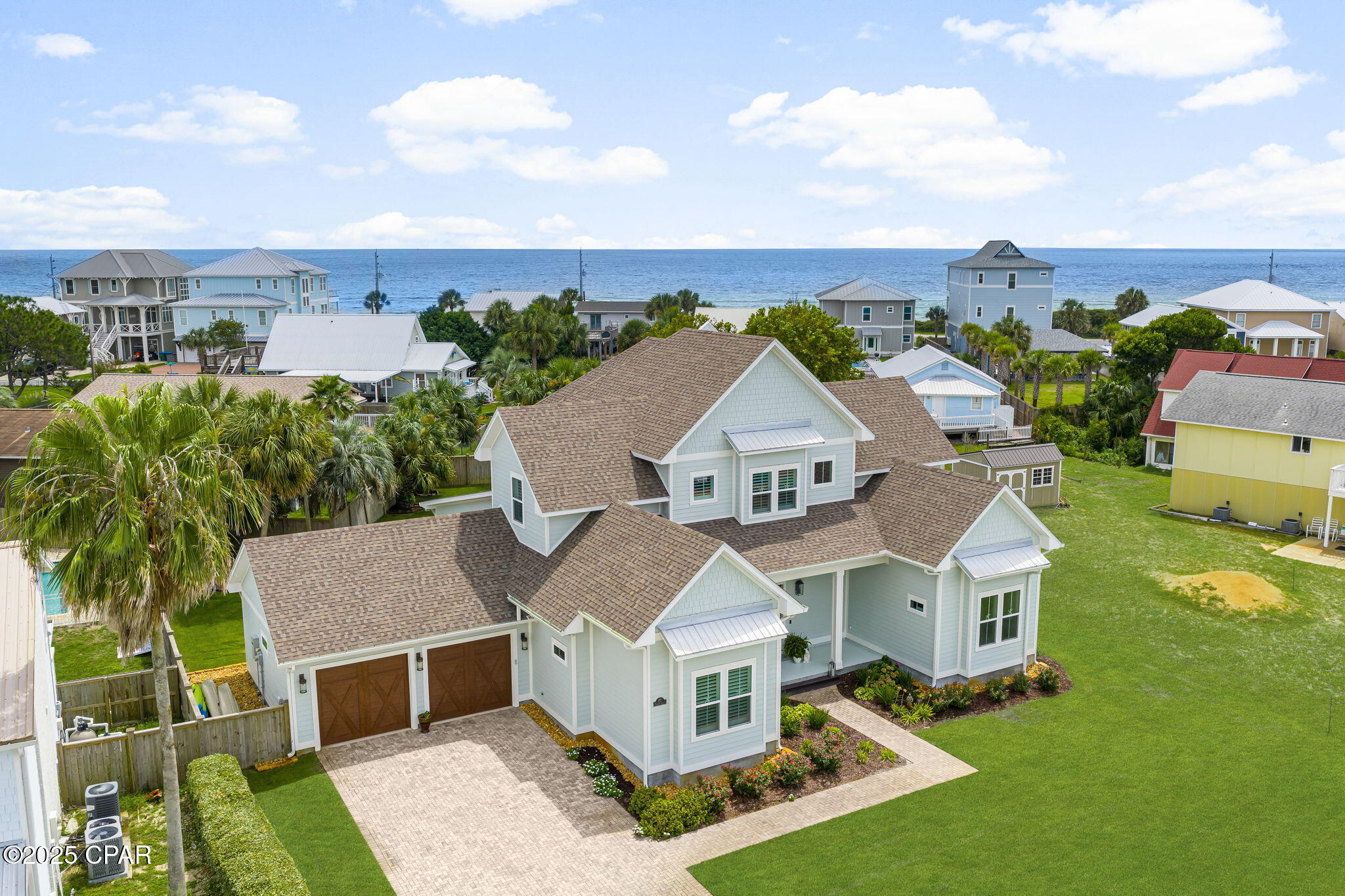 **JUST REDUCED!!** Luxury Beach Retreat Home for Sale in the West end of Panama City Beach, FL.  Come and Experience the ultimate beach lifestyle in this stunning custom-built home on Panama City Beach's quiet and desirable West End. Completed in 2021 by acclaimed builder Rick Koehnemann of Koehnemann Construction, this 4-bedroom, 4 1/2 bathroom home combines exquisite craftsmanship with modern amenities. This Property offers both luxury living and exceptional rental potential.  This home was designed for Comfort, Relaxation & Entertaining!
Just a few houses from the beach on an oversized lot, the property provides a spacious outdoor yard with room to design your own swimming pool. A fully fenced backyard with privacy fencing and beautiful, mature landscaping creates a sense of comfort and seclusion. A back gate leads to a short walk over the dunes to the undeveloped natural beach--where sand, sea oats, and the beautiful Emerald waters of the Gulf, makes it feel like your own private stretch of coastline.
This home provides you with an Open-concept main level with sliding glass doors that flow onto a covered screened patio for seamless indoor/outdoor living.
The Primary suite is on the main level, plus an additional bedroom provides flexibility and convenience.
The indoor elevator adds access to all levels.
Second floor features its own living space with a family room, open office area, two guest bedrooms, and a bunk room--perfect for large gatherings, multi-family vacations, or rental flexibility.  Bedrooms and the family room access the expansive covered balcony with seasonal Gulf views and refreshing sea breezes.
The upstairs bunk room with twin beds gives more flexibility for guests which is perfect for hosting large families or groups.
Premium Features & Upgrades are,
• Double crown molding throughout main living areas and the Primary bedroom, Single crown molding in guest bedrooms, 9 Inch baseboards throughout, 8 ft tall solid wood doors throughout the home, and 4 Inch Plantation Shutters throughout.
• Soaring 12-foot ceilings on the lower level and 10-foot ceilings upstairs.  Surround sound system in Living room. Garage Attic space completely covered in 1'' plywood for added storage. 
• Tankless hot water heater for efficiency and convenience.  Trex deck with railing for ease in maintenance
• The house is wired for a whole-house generator and a future swimming pool installation.  Tons of Storage!
• Gulf Vista is a non-HOA  Neighborhood with underground utilities, preserving both reliability and beauty.
• The Outdoor shower is ideal for rinsing off after beach days.  
This home is a short drive to 30A, Rosemary Beach, premier restaurants and shopping.  Pier Park is a destination with a variety of restaurants, shopping, an IMAX theater, and exciting new attractions including Dolly Parton's Pirates Voyage Dinner Show and Topgolf.  
This thoughtfully designed Luxury Custom built home offers the best of both worlds: a serene coastal retreat for your family and a high-demand short-term rental opportunity in one of Florida's most coveted beach destinations, Panama City Beach, FL .