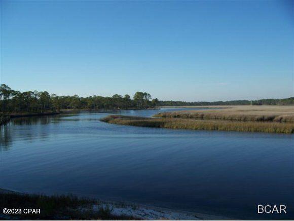 MOTIVATED SELLER! PRIME 1.25 ACRE WATERFRONT HOMESITE!  BUILD YOUR DREAM HOME AND ENJOY  AMAZING VIEWS OF  WEST BAY! Rivercamps is a  gated, waterfront community consisting of 1,500 acres  with less than 450 homesites. One thousand  acres of committed conservation land.
This prime homesite overlooks  the waters of Crooked Creek, West Bay and the Intercoastal Waterway. Located just 10 miles from the pristine beaches of Panama City Beach, this site is  for those who enjoy nature and an active lifestyle. 
Rivercamps features over 7 miles of connected trails and boardwalks for walking, running, hiking or biking.
RIde your golf cart to the  new waterfront  Clubhouse with  pool and pavillion scheduled to open in August, 2025. Other amenities include two pickle ball courts, a basketball court and a 600 foot dock, 
There are also kayaks, canoes and padde boards for owners use. A community boat ramp feeds into Crooked Creek and West Bay providing direct access to Shell Island,  the Gulf  and the Intracoastal Waterway. Dry boat storage, and day use boat slips are also included in the low HOA. The NW Florida Beaches International Airport is a short drive away. 
This community is a great value. Don't wait! Lot 191 is perfectly situated to offer amazing water views,