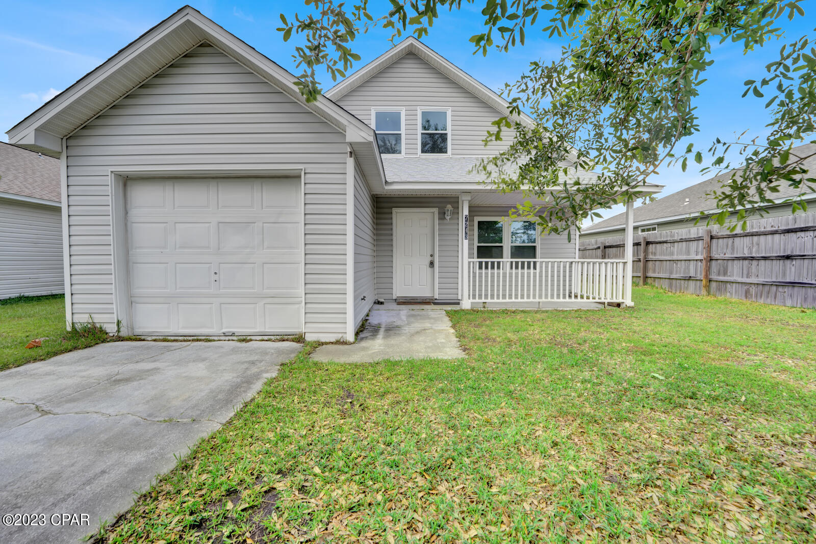 Experience the tranquility of North Sweetwater Village's residential area with this charming two-story home. Boasting four bedrooms and two bathrooms, this property is nestled in a highly desirable neighborhood. The interior has been extensively renovated, offering a modern and fresh ambiance. Throughout the house, you'll find stylish gray vinyl plank flooring, creating a cohesive and low-maintenance aesthetic. The kitchen is a standout feature, featuring newly installed white cabinets with lazy Susan organizers and a sleek over-the-stove microwave. Conveniently attached to the home is a garage, providing both shelter for your vehicle and additional storage space. To truly appreciate the beauty of this gem, contact us today via call or text to schedule a viewing. Don't miss out on this fantastic opportunity to own a nearly new home, meticulously renewed after the devastation of Hurricane Michael in 2018. With a new roof, doors, windows, vinyl siding, floors, ceilings, lights, fans, insulation, paint, kitchen cabinetry, and countertops, this property offers a fresh start. Upgrades include a programmable thermostat, double-pane tilt-in windows from Window World for easy cleaning, solid wood stair treads, and a chandelier at the bottom of the stairs. Make this meticulously renovated home your own and enjoy a comfortable and modern living experience.