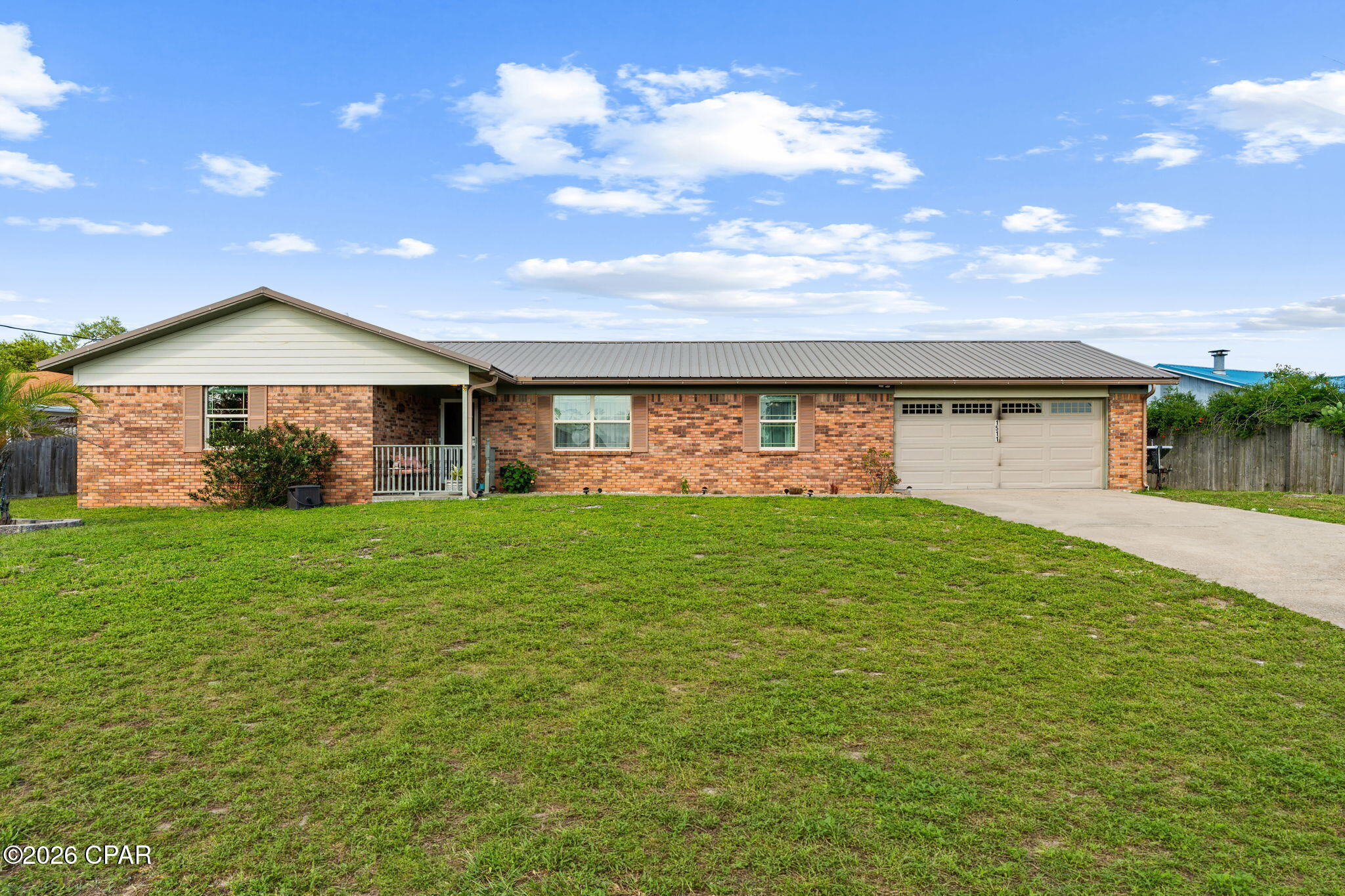 Welcome to 1511 Donna Avenue! This 3-bedroom, 2-bath home offers a functional layout and a fantastic location in Panama City, just a short drive from Tyndall Air Force Base, Under the Oaks Park, and the bay.

Inside, you'll find a spacious living room featuring a beautiful beamed cathedral ceiling, a cozy wood-burning fireplace, and a kitchen with a large center island that's perfect for gathering with family and friends. The primary suite includes a walk-in closet, while the additional bedrooms offer flexibility for family, guests, or a home office.

Step outside to enjoy multiple outdoor living spaces, including a screened-in porch, a covered deck, and an adjoining open deck. The detached storage building with electricity is perfect for a workshop, hobbies, or additional storage.

Conveniently located near shopping, dining, schools, and parks, this home offers plenty of space to enjoy both indoors and out. Schedule your private showing today!