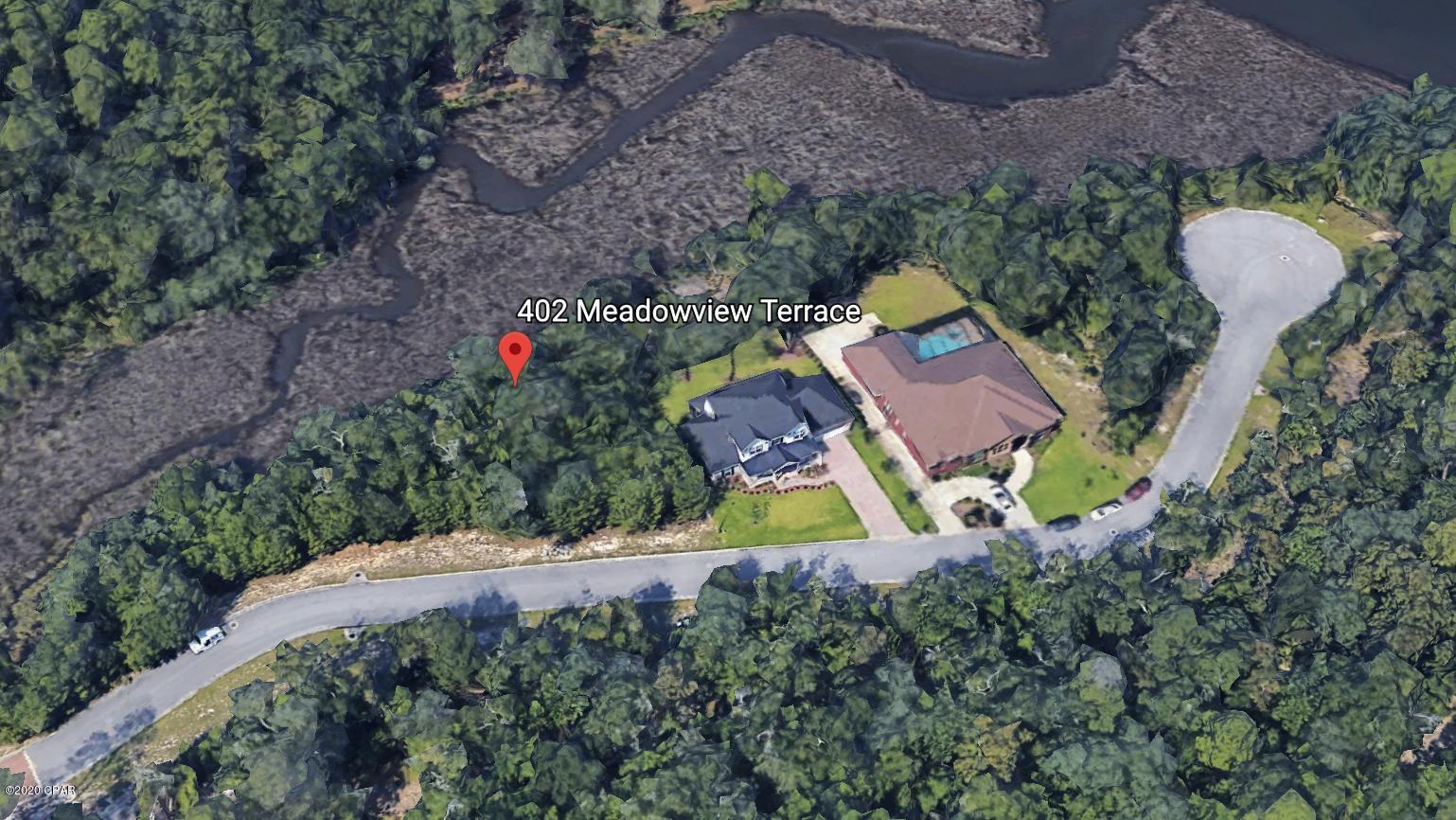 Nearly 1/2 acre lot in The Meadows & The Point subdivision located on a cul-de-sac, this lot offers privacy and tranquility! Perfect for building a home and taking advantage of the nearby golf course. Lot offers mature oaks along with existing spectacular wooded area. All measurements, sizes and other listing information should be verified if deemed important.