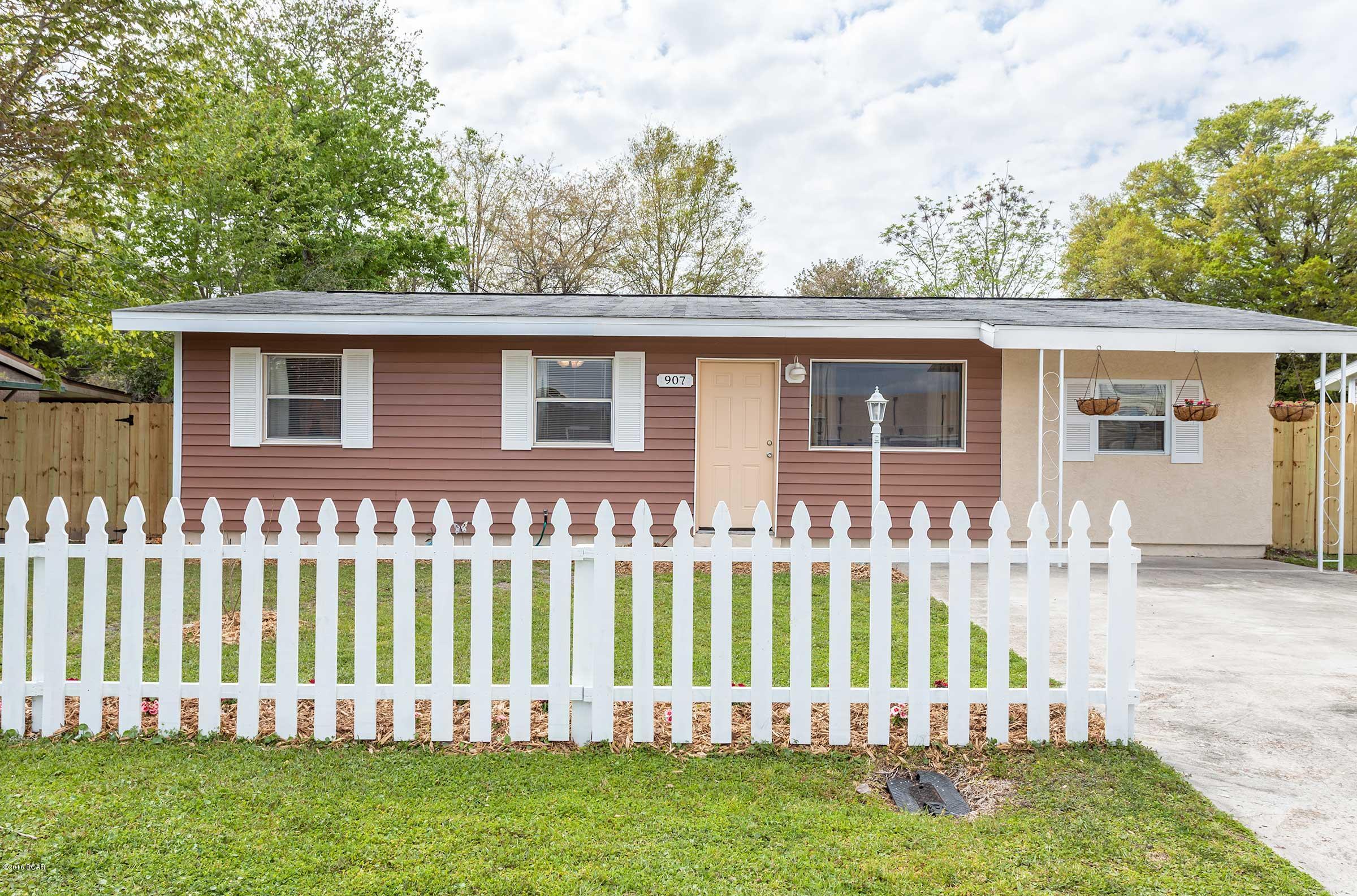 ADORABLE inside and MOVE-in READY! Totally updated home features spacious rooms, new vinyl engineered plank floors and brand new carpet, 3 ton high efficiency HVAC installed in 2011. Kitchen has brand new appliances and plenty of cabinets for storage and nice dining area and both living areas that wings off each side of the kitchen. The Large Family room (18X12) has a brand new slide glass door to your fenced backyard for the puppies. The additional bedroom has a large walk-in closet, while the wider bedroom (12x20) has space for a nursery or craft room, plus his and hers closet.  Spacious laundry double room! Big New Yard building for extra storage. No honey-dos here! Seller is providing a 4-Point Inspection Report & Wind Mitigation report. Call you REALTOR today for a private Showing!