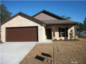 This home is beautiful. You need to take a look. You won't be disappointed. This is a cute three bedroom two bath home located near Southport Elementary School. There are raised ceilings in the living area with a boxed ceiling in the great room and master bedroom. The master bath has two sinks and a nice tile tub and shower combo. Granite counters in the kitchen and bathrooms. You can watch your children walk to school from your covered front porch. The site is high and dry with a fenced yard and covered rear patio.