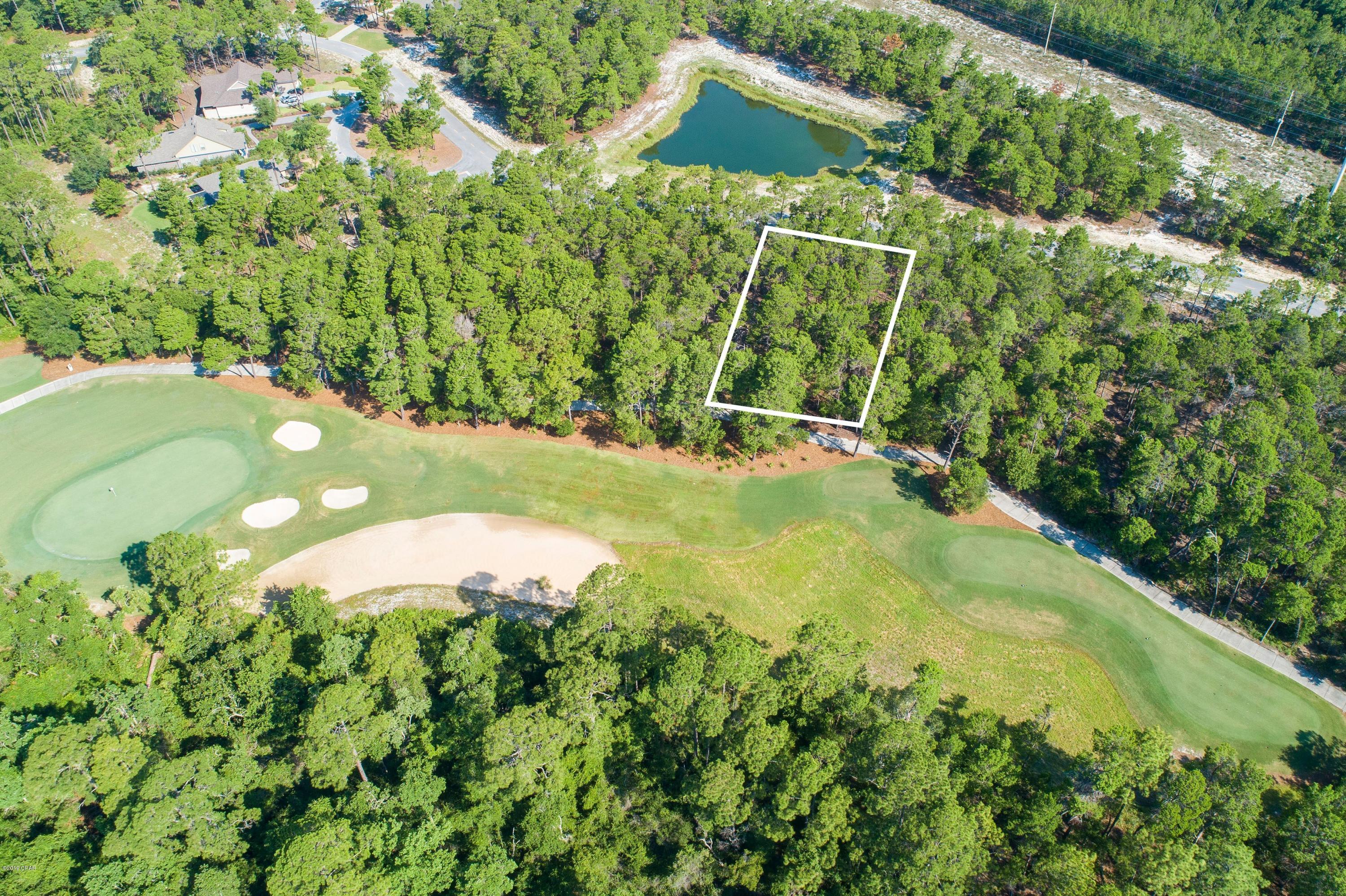 ONE OF THE LARGEST LOTS IN WILD HERON (LOST COVE LANE) BOASTING OVER A HALF ACRE! Great deal in Wild Heron! This 11th fairway lot is being offered for the low price of $85,000. Motivated seller, bring all offers! Golf Course Residential Lot on the beautiful 11th Fairway of Greg Norman's Sharks Tooth. Convenient to the Clubhouse, Pro Shop & Driving Range. Prospect Point is home to the lakeside Fitness Center, Pool/Hot Tub, Owners Library, Boardwalk, Fire Pit & Community Dock. The Boat House features canoes & kayaks for owner use on Lake Powell. There are membership opportunities available for Golf as well as the Watercolor Beach Club. Come experience the lifestyle that Wild Heron has to offer. You will find a true sense of community here