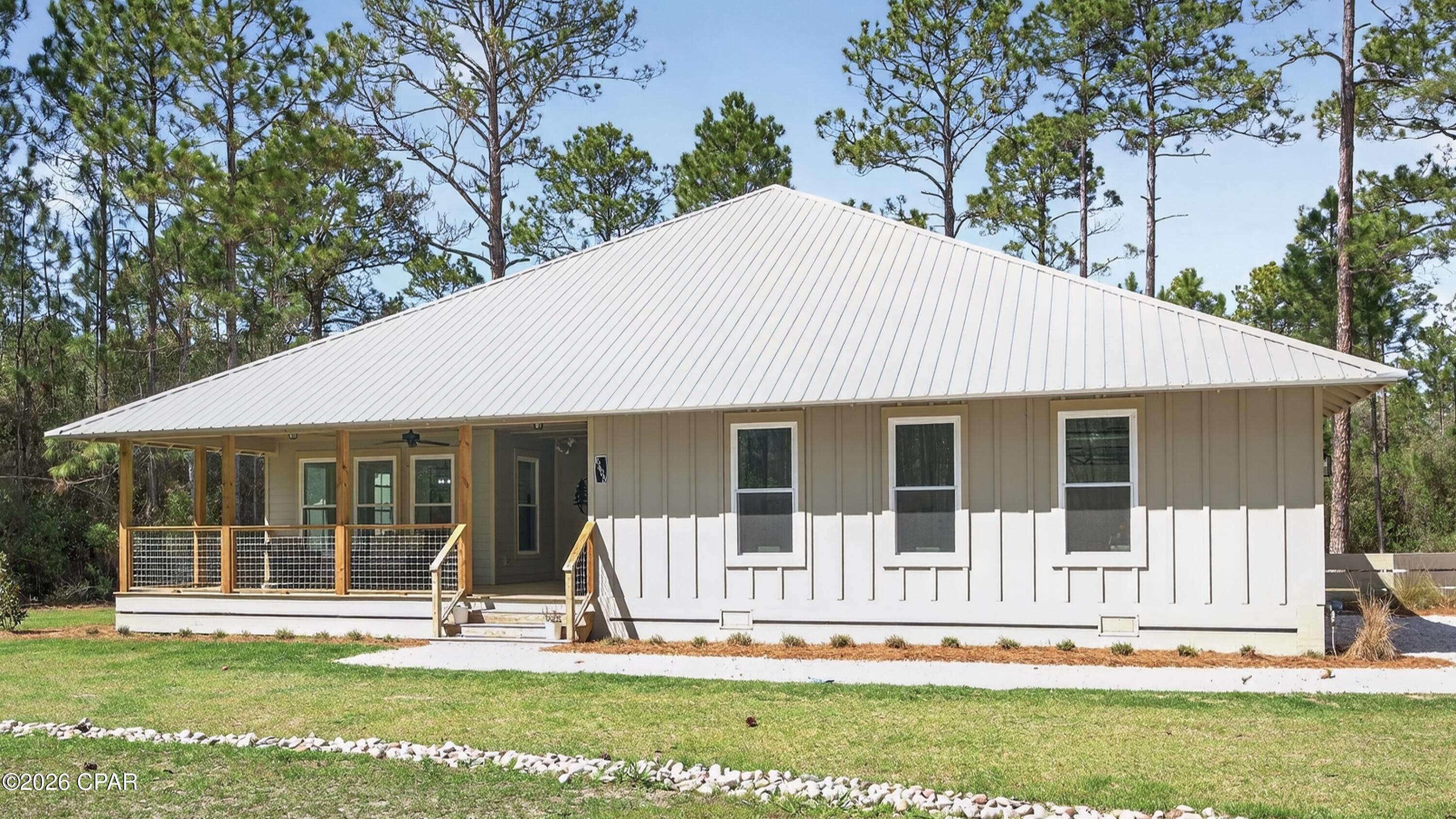 Welcome to 6608 Button Buck Trail, nestled within the highly sought-after RiverCamps community in Panama City Beach. Where nature, privacy, and coastal living come together effortlessly.

Surrounded by preserved woodlands and peaceful scenery, RiverCamps offers a lifestyle unlike anywhere else. Enjoy access to a community pool, scenic boardwalks, boat storage, and a private boat launch, perfect for days spent exploring the water or unwinding in nature. This quiet, tucked-away neighborhood is ideal for those craving both adventure and tranquility.

Built in 2025, this beautifully crafted home offers 2,238 heated and cooled square feet with a thoughtfully designed open floor plan that feels both spacious and inviting. Every detail has been carefully constructed, showcasing quality finishes, stunning architecture, and timeless design throughout.

The home features 3 bedrooms and 2.5 bathrooms, along with granite countertops, a gorgeous kitchen, and all appliances included, making it truly move-in ready. A home generator adds an extra level of comfort and security, a rare and valuable feature.

Step outside to a fenced-in backyard, perfect for pets, entertaining, or simply enjoying the peaceful surroundings. The spacious two-car garage provides ample storage for all your coastal lifestyle needs.

If you've been looking for a home that blends modern comfort with the beauty of nature, this is your opportunity to experience the best of RiverCamps living.

** All furniture shown in photos is for staging purposes & does not convey.