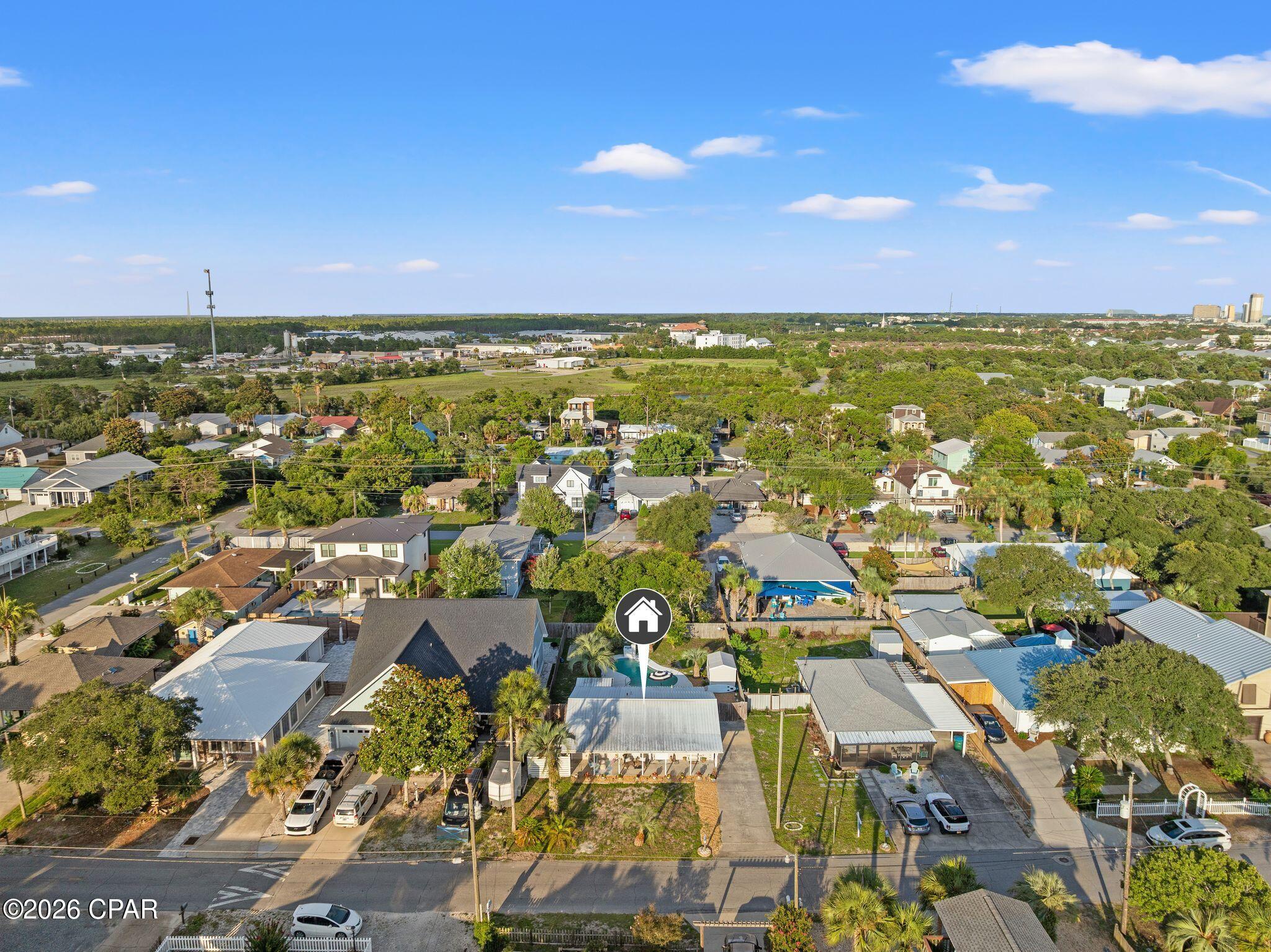 Welcome to your slice of paradise on the highly sought-after west end of Panama City Beach! Just one block from the sugar-white sands and emerald waters of the Gulf, this beautifully updated 3-bedroom, 2-bathroom home offers the perfect blend of coastal charm, modern upgrades, and the laid-back Florida lifestyle.

Step inside to discover a bright, inviting interior featuring an updated kitchen with beautiful quartz countertops, tiled backsplash and an oversized farmhouse-style sink The open, functional layout flows effortlessly into a spacious sunroom overlooking the backyard, creating the perfect space to relax with your morning coffee or unwind after a day at the beach.

The primary suite is a true retreat, featuring a stunning bathroom that has been completely remodeled from the ground up with stylish, high-end finishes and thoughtful design.

Step outside and experience the backyard that truly sets this home apart. Your private tropical oasis features a sparkling in-ground pool, lush landscaping, generous outdoor living space, and a covered patio perfect for grilling, dining, or enjoying warm Florida evenings. Whether you're hosting pool parties or simply soaking up the sunshine, this incredible backyard is designed for making memories.

Whether you're searching for a full-time residence or a second home, look no further.  Located on the desirable west end of Panama City Beach and just 15 minutes from the renowned communities, restaurants, and beaches of 30A, you'll enjoy the best of both worlds--peaceful beach living with easy access to some of the Emerald Coast's most popular destinations.

With the Gulf just a short stroll away, thoughtful updates throughout, and an unbeatable outdoor living space, this is the Florida beach home you've been waiting for. Don't miss your opportunity to own a coastal retreat where every day feels like a vacation.