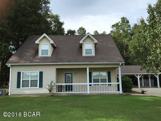Darling Country Home Minutes From Town. Down stairs you will find an open floor plan with a spacious livingroom, dining area, kitchen and utility room. The master bedroom is oversized with a walkin closet, and masterbath has a shower and seperate garden tub. Upsatirs boasts two large bedrooms with a sitting area that could be another bedroom if needed, a full bathroom and two storage areas that are H&C. Outside has a workshop/garage, two car carport, chainlink fencing, landscaping, and a concrete driveway. Property has paved road frontage.