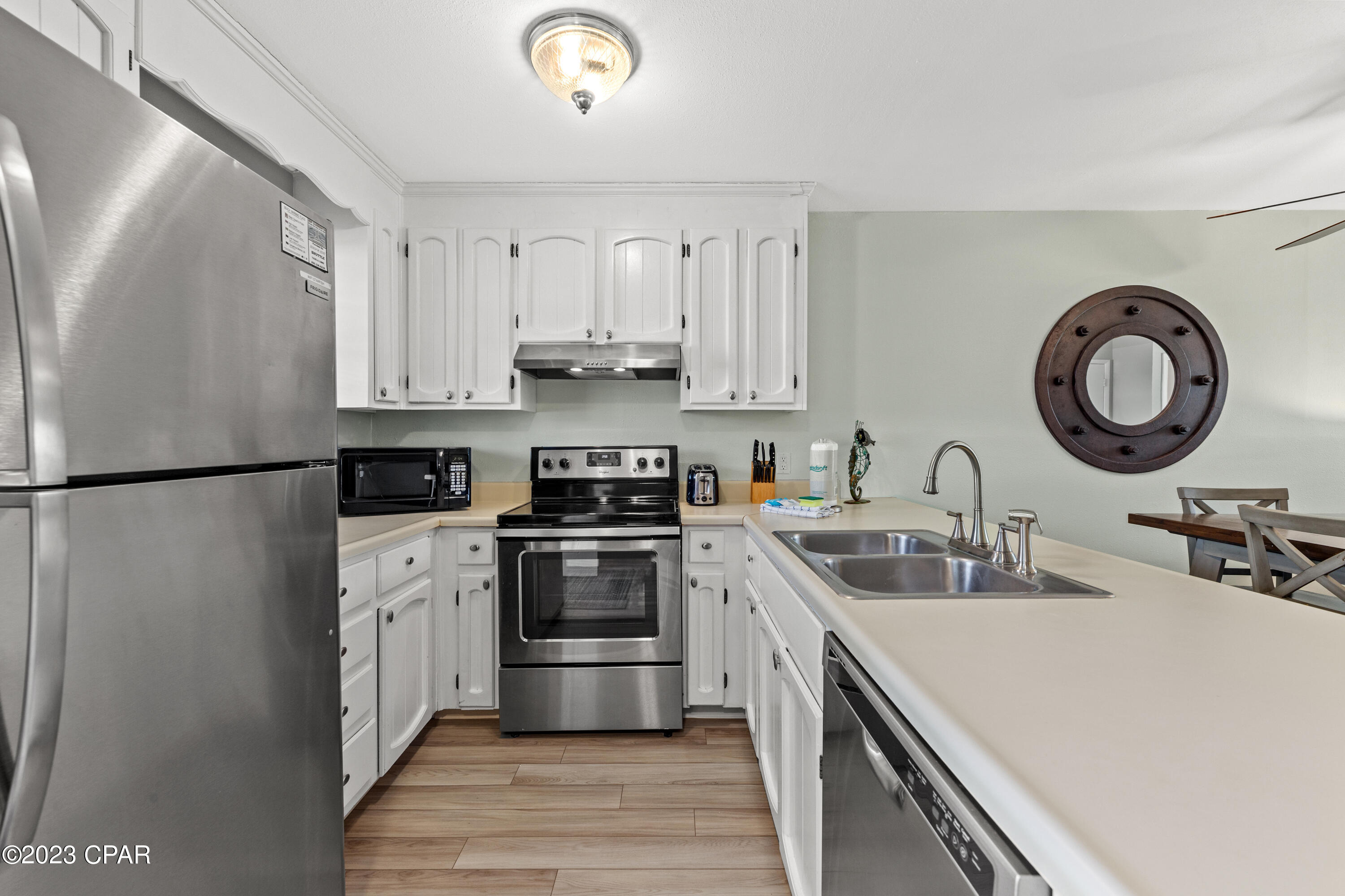 LOCATION, LOCATION, LOCATION. Move in ready and furnished. Not in a flood zone. This townhouse is on Front Beach Rd. w/ Gulf views & steps away from the sugar white sands. NO HOA FEES!  Brand new septic system. Fresh paint inside & out. Located on the desirable, quite west end, at the beginning of Laguna Beach. This townhouse has both front and back patios & upper decks. The front deck has gulf views & the back deck has pond views. Both the full & half bath have been recently remodeled. Plenty of closet space inside & out. All appliances are Stainless Steel & are only 3 yrs old. Washer & Dryer are included. Walking distance to Thomas's Donuts, Carousel Market & Liquor Store

Close to Pier Park and lots of restaurants. This could be a great vacation rental property.