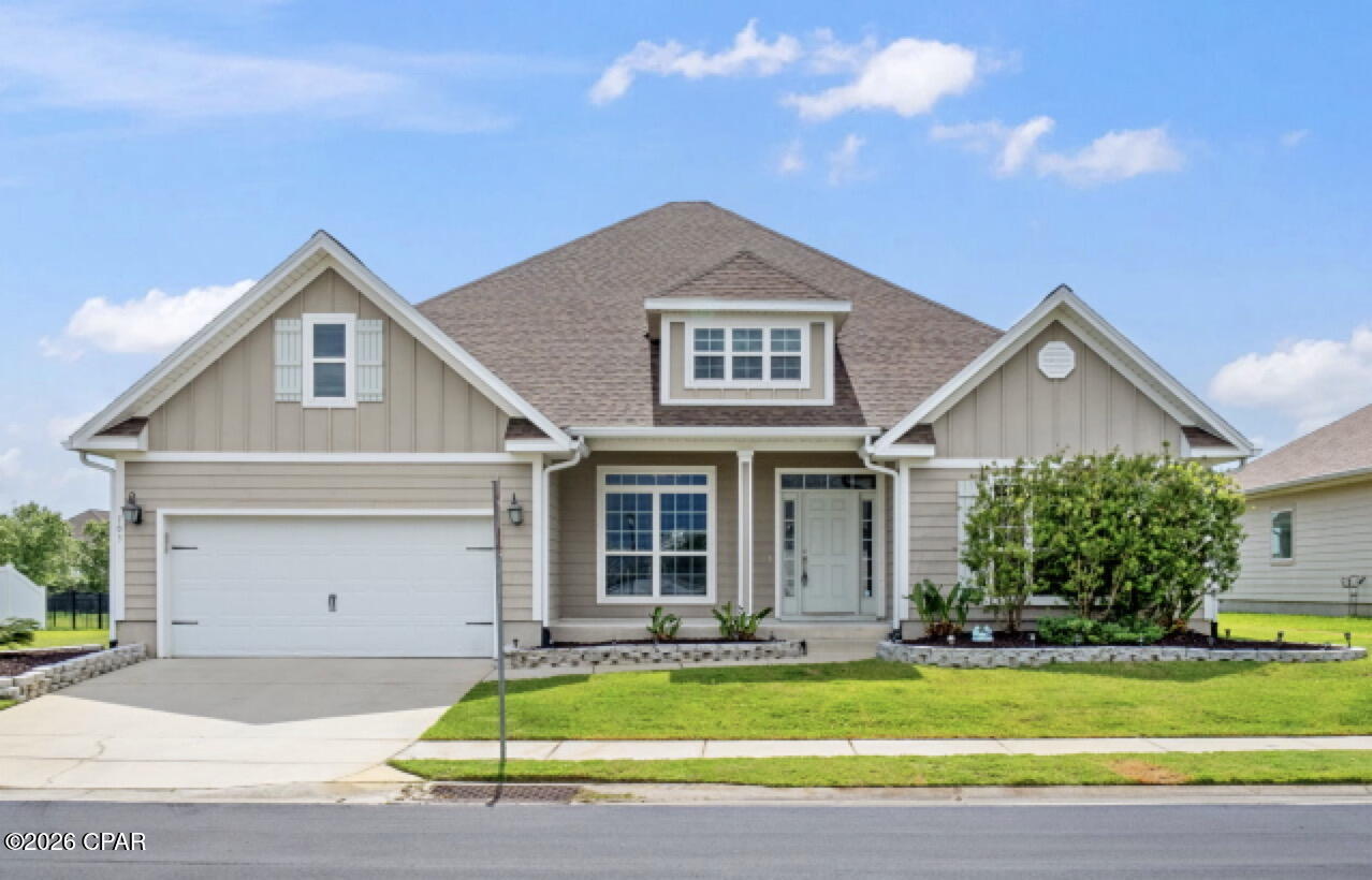 With Hardie board construction, thoughtful upgrades, and room for everyone, this 5 bedroom, 3 bathroom home is designed for everyday living and entertaining alike. Inside, you'll find vinyl plank flooring throughout most of the home, with carpet in 4 of the secondary bedrooms for added comfort. In addition to the 5 bedrooms, there is a large flex space perfect for a playroom, office, media room, or home gym. The open living room and formal dining area both feature elegant tray ceilings, while the oversized pantry provides exceptional storage. The spacious primary suite is a true retreat with tray ceilings, double vanities, a tile walk-in shower, soaking tub, and an enormous walk-in closet.
Step outside to enjoy the screened-in back porch overlooking the peaceful retention pond, along with a fenced backyard featuring an iron rod fence. The oversized garage offers space for up to 4 vehicles, golf carts, storage, or hobbies. A large covered front porch adds even more outdoor living space and welcoming curb appeal. Located just a few homes away from the community pool and green space, residents of Village at Mill Bayou also enjoy scenic fishing areas and convenient access to nearby amenities. Just minutes away is Lindsey Crossing featuring Publix, Starbucks, shopping, dining, and more.