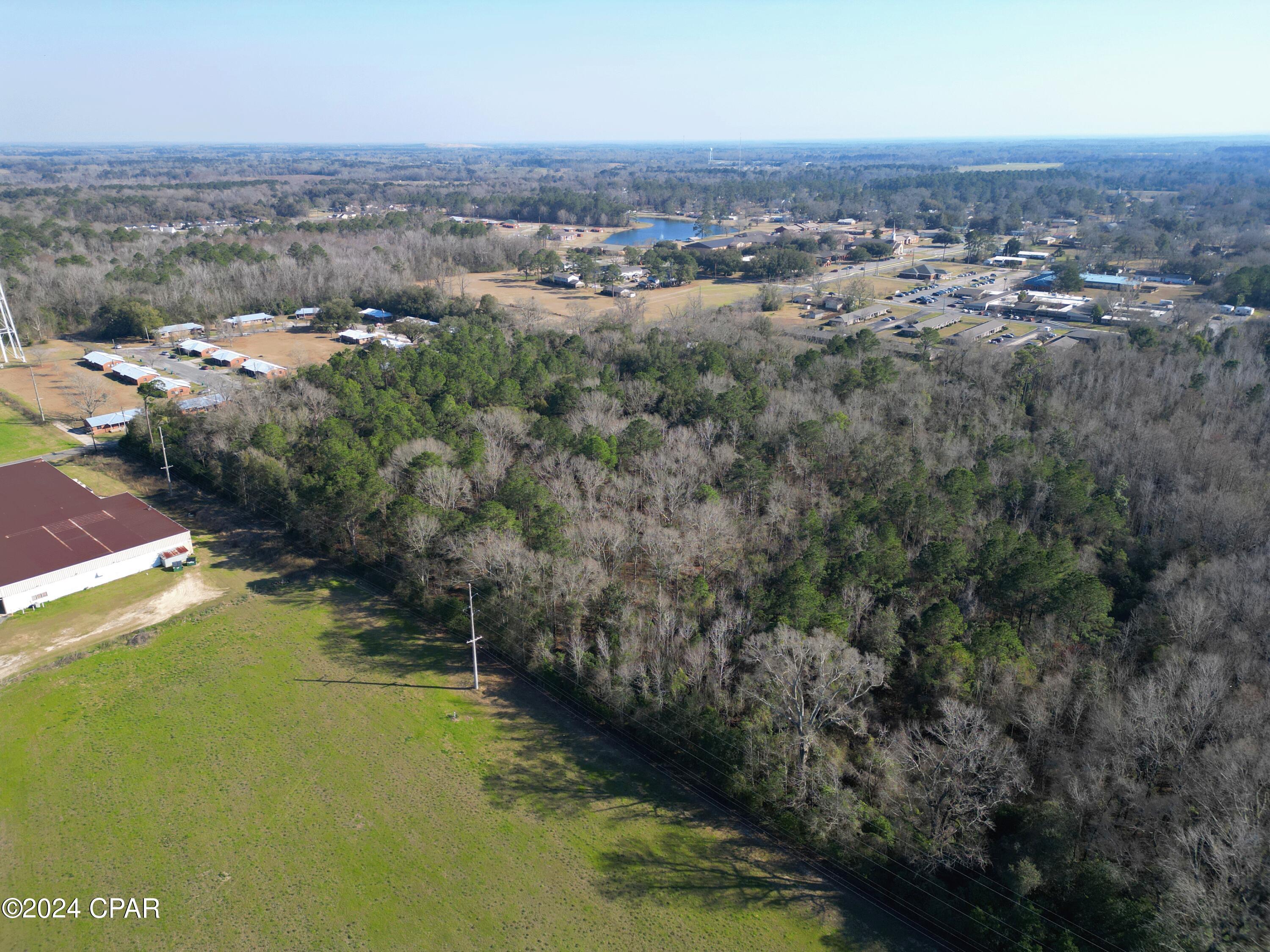 Welcome to an extraordinary canvas of possibilities nestled within the heart of Graceville, FL. This 10-acre residential haven offers you the rare opportunity to craft your dream home in a setting that seamlessly combines tranquility with urban convenience.

Imagine waking up in your custom-built residence, surrounded by 10 acres of pristine land, all within the city limits of Graceville. This exclusive property comes with residential zoning, ensuring a tranquil and undisturbed atmosphere, as no livestock or agricultural activities are allowed.

The location is nothing short of idyllic - a slice of paradise within city limits. Enjoy the peaceful charm of Graceville while having essential amenities, schools, and community services at your fingertips.

The infrastructure is already in place, with available water and septic systems ready to accommodate your dream home. 

Ease of access is guaranteed with paved road frontage, providing a smooth journey to your future oasis. Picture arriving effortlessly at your private haven, where the paved road enhances the overall accessibility and appeal of your property.

The versatility of this 10-acre parcel allows you to bring your vision to life. Whether you choose to subdivide for potential investment or create your private oasis, the canvas is yours to shape.

This is more than just land; it's an invitation to design a lifestyle uniquely tailored to you. Your blank canvas awaits - come, envision, and make this residential haven the foundation of your dreams in Graceville,​​‌​​​​‌​‌​​​​‌​​‌​​​​‌‌ FL.