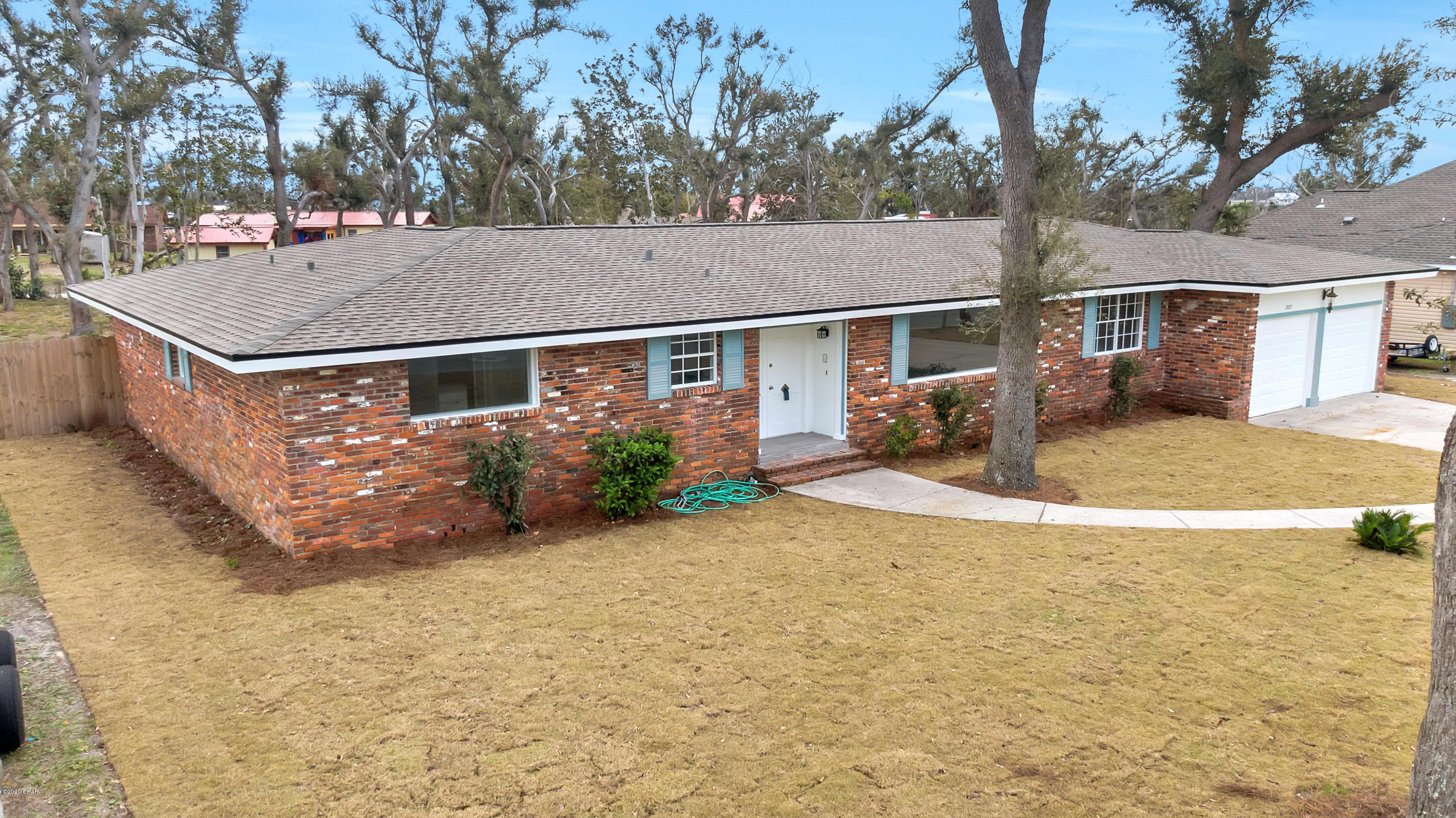 CURRENTLY UNDER CONTRACT, SELLER ACCEPTING BACKUP OFFERS.  Totally Remodeled & Renovated, 4-sided Brick Home, Close to Tyndall Air Force Base in Panama City, FL. This large home features over 2200 square feet, with 4 bedrooms, 2 baths and a HUGE backyard on over a 1/2 acre lot!  Home is in Donalson Point located  in between Parker Bayou and Pitts Bayou, w/ views of the water from the front yard. This home is only a short distance from a deep water public boat ramp accessing East and West Bay, as well as the Gulf of Mexico.  Complete New roof installed, including all new decking boards.  If you want an open floorplan, this home has it!  Sliders lead out to the large backyard. The Kitchen boasts a spacious breakfast bar, new quartz countertops, white subway tile backsplash, upgraded lighting has new sod Zoysia grass, which is known to be drought-tolerant and is best suited for warm climate conditions. Hot water heater just installed Feb. 2020. All New HVAC system including most new ductwork.  New laminate flooring has been added throughout the home. Both bathrooms are completely remodeled. The Master Bath features a Rainfall shower head, tile walk in shower.  Home has low maintenance brick exterior & a 2 car garage.  Conveniently located only a short distance to Tyndall Air Force Base.  Make this beautiful, move-in ready home yours today!