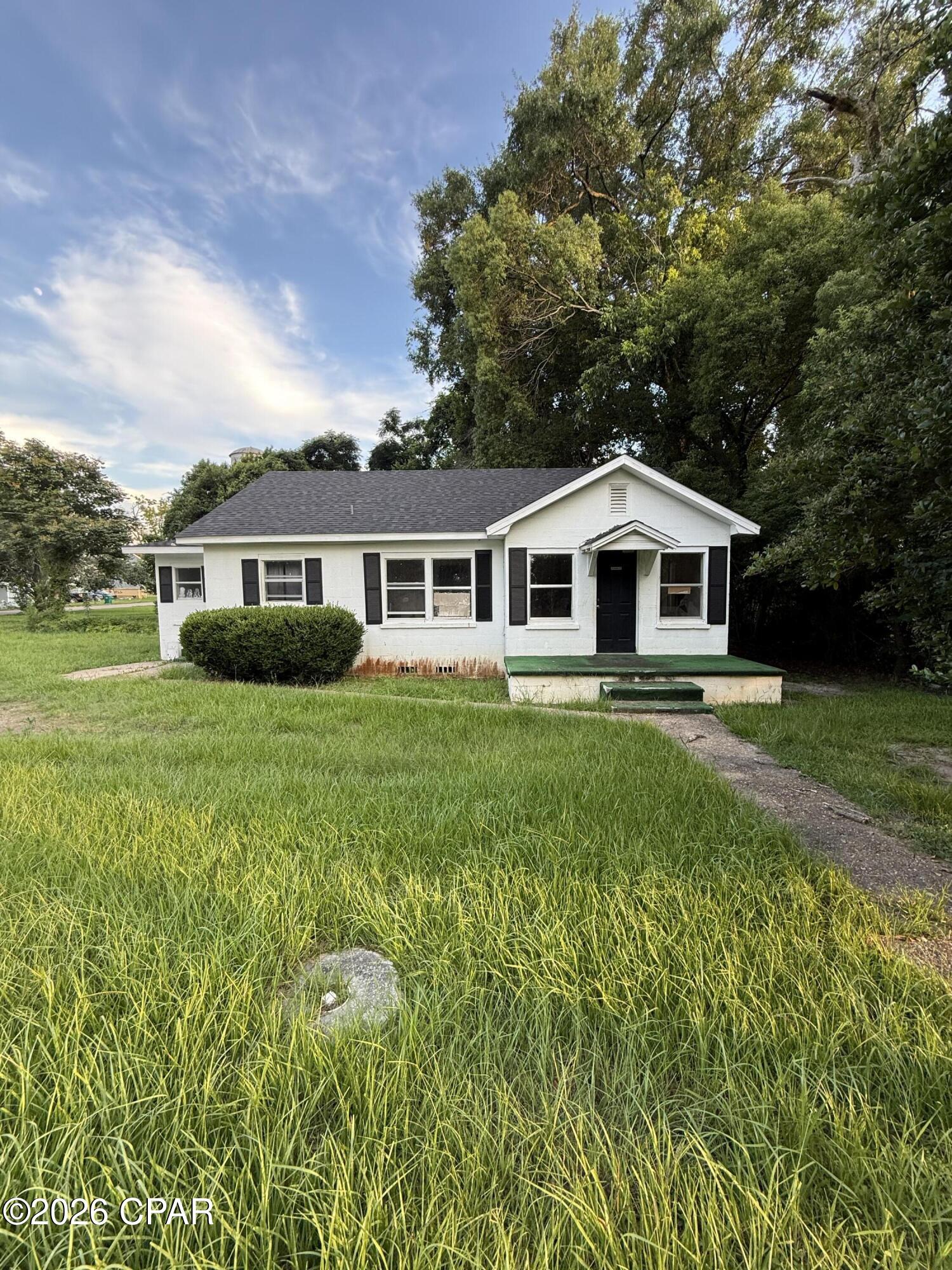 Investor opportunity with endless potential! Whether you're looking to renovate and flip, create a primary residence, or add to your rental portfolio, this property offers exceptional possibilities. Conveniently located within the city limits on a quiet street, this 3 bedroom (with flex room)/1 bath craftsman home (block siding) features charming curb appeal and sits on a spacious .292 acre corner lot (encompassing three lots) with plenty of room for expansion, outdoor living, or future enhancements. Major updates already completed include a new roof less than one year old and a newer HVAC system installed in 2022. This home is in need of renovations and repairs presenting an excellent opportunity to add value and customize the space to fit your vision and style. Don't miss the chance to unlock the potential of this hidden gem--schedule your showing today!