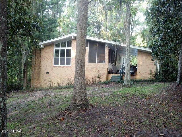 ANOTHER PRICE REDUCTION!!! WATERFRONT home on Merritt's Millpond!! Home has been recently updated with energy efficient windows and doors, newly painted interior, and has nice features that include oak hardwood floors, glass sliding doors leading to a lovely screened porch, birch kitchen cabinets and more! The nicest thing is to walk out into your own yard and see the wonderful, waterfront views, and admire the crystal clear waters of this spring fed lake! This lake is home to the World Record Shell Cracker, and it is also full of Huge Black Bass and Blue Gill! Sit on your dock and watch the water fowl and feed the fish, or take a short boat ride up this Beautiful Lake to the headwaters where you can swim and dive in some of the most beautiful springs in all of Florida!