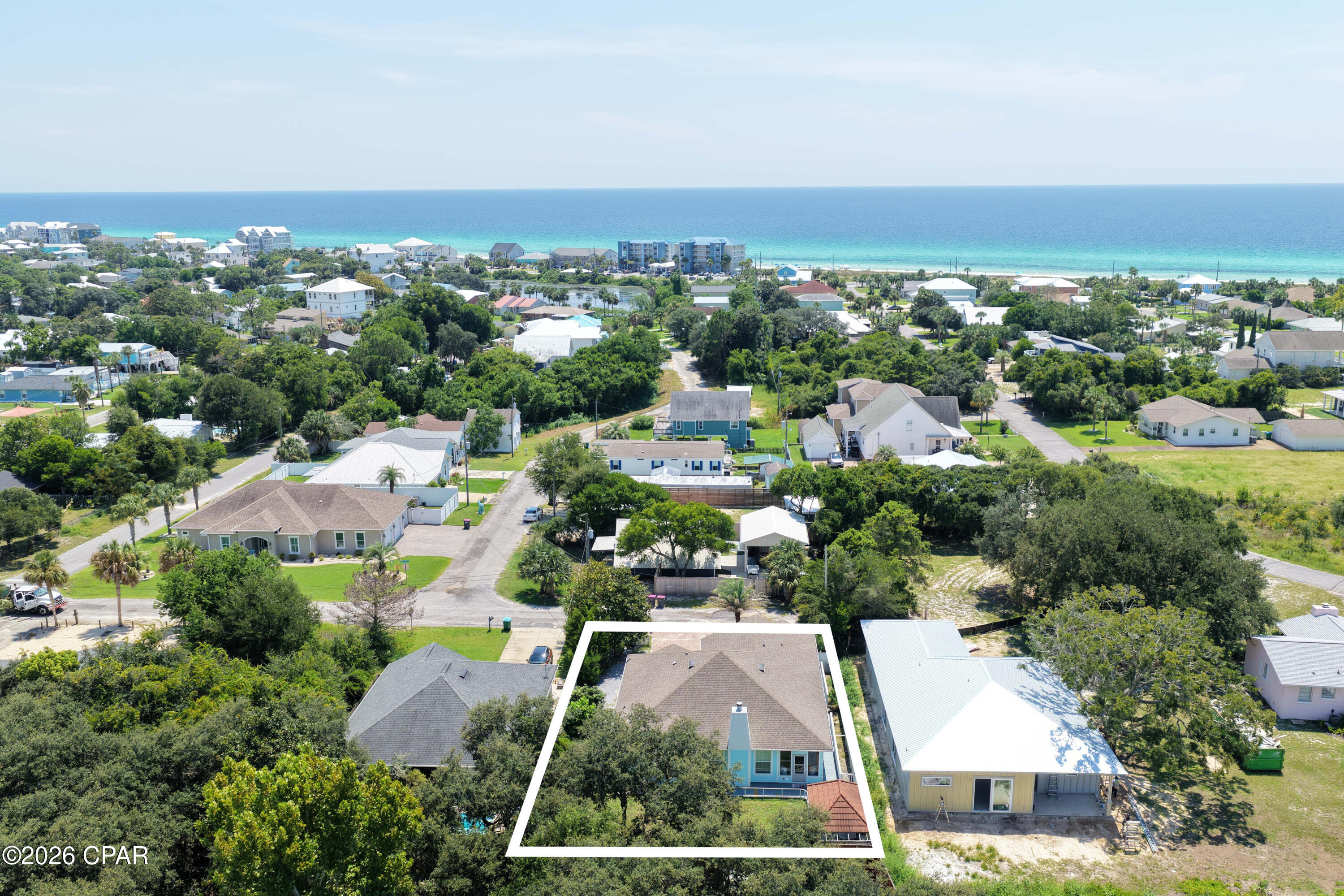 Experience the best of beach living in this custom-built Laguna Beach retreat.
Located just a short walk from the sugar-white sands and emerald waters of the Gulf, this custom-built 3-bedroom, 2.5-bath home offers 1,882 square feet of living space, including a bonus sunroom. 

Situated on a quiet dead-end street in the golf-cart-friendly community of Laguna Beach, the property combines quality construction, strong rental potential, and ample parking. The home's south-facing orientation fills the interior with natural light and provides beautiful sunrise and sunset views throughout the year.

Built with 2x6 exterior walls, impact windows, Hardie Board siding, architectural shingles, paver driveway, and premium roof decking, the home was designed for durability and low maintenance. The split-bedroom floor plan features an open living area and a well-appointed kitchen with walk-in pantry, KitchenAid stainless appliances with wall oven, a Bosch dishwasher, custom hood vent, and a beautiful sea-blue backsplash.

Ideal for a primary residence or second home, the property includes a covered front porch, a two-car garage, extra parking for multiple vehicles, and space for a boat, RV, trailer, or golf cart. With no HOA and short-term rentals allowed, it offers flexibility for both full-time living and investment use.

The fenced backyard features an outdoor shower, large deck and patio, ample room for a resort-style pool, and a custom gazebo constructed from exotic Ipe wood imported from South America, creating a unique outdoor living and entertaining space.

Additional features include a wood-burning fireplace with stone surround, heated bathroom exhaust fans, rain-head walk-in showers, custom built-in shelving, and a bay window in the primary bedroom overlooking the backyard.

Located near public beach access #84, the home is conveniently located within a 10-minute drive either way between Pier Park and the 30A corridor near Rosemary Beach, providing easy access to shopping, dining, entertainment, and the beach.  Buyer to verify all data and dimensions if important as some measurements are approximate.