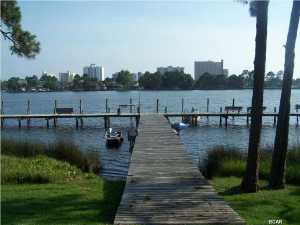 LAGOON FRONT COMPLEX- End unit with Lagoon views, 2 bedroom 2.5 bath unit with tile and carpet floors, balcony, patio and covered parking space. Boat slips available at no extra costs, first come first serve basis. Palisades amenities include Lagoon side pool, tennis courts and clubhouse. SOLD AS IS, BUYER TO VERIFY ALL DIMENSIONS.