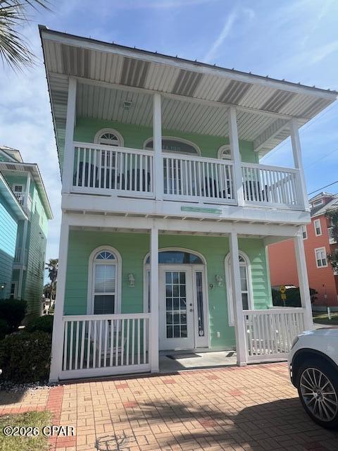 Beach cottage located across from Beach Access point! Peek-a-boo view of the Gulf, close to Pier Park, the Pier and grocery store.  Detached two story home featuring  two bedrooms each with a private full bathroom on the main level.  The primary bedroom has access to the outside and walk-in-closet.  The reverse plan with bedrooms down allows you to take advantage of the views from the living room and balcony.  There is a half bath on the living room level.  Fully equipped kitchen with updated dishwasher, stove and microwave oven.  Washer and Dryer  are included  Community pool, home has outdoor shower and parking for 4 vehicles. A/C replaced in 2025, stove and dishwasher are less than 2 years old. Windows on the East side of the home have been replaced in May 2026.