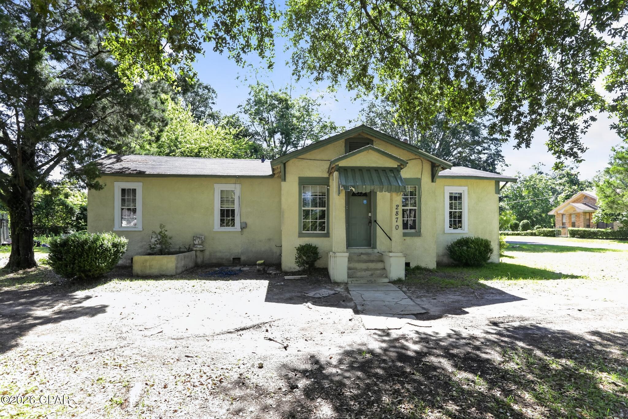 Handyman special with big potential off Penn Ave! This one-story home features spacious rooms, wood floors, abundant natural light, a kitchen with black cabinetry, full bath, mature shade trees, and a partially fenced yard. Updates are needed, making it great for investors or buyers ready to build equity. One of Marianna's best-priced homes-bring your tools and vision!