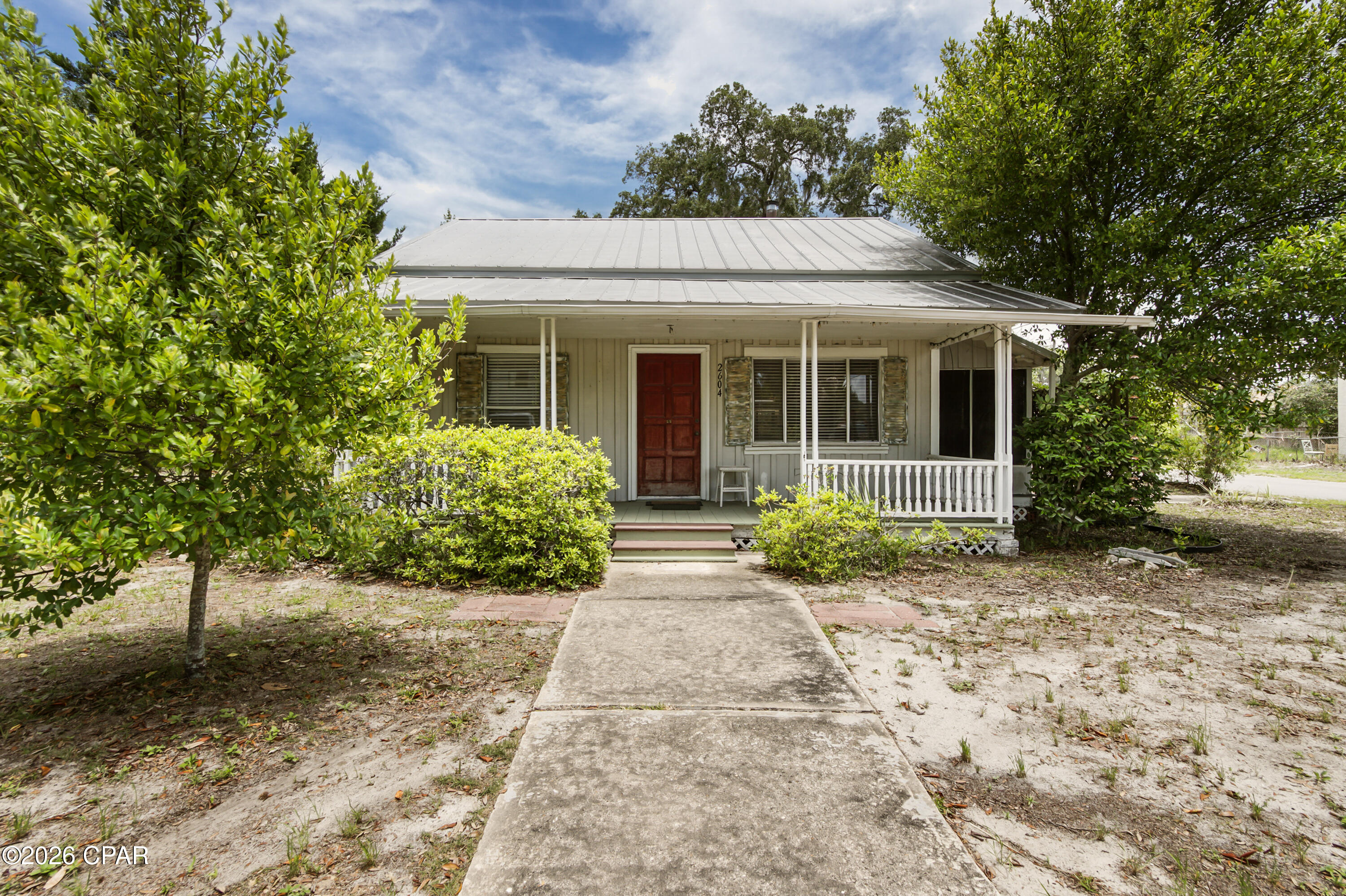 Opportunity awaits at 2604 West 10th Street in Panama City, Florida! Conveniently located near shopping, restaurants, schools, parks, medical facilities, and just a short drive from the area's beautiful beaches and waterfront attractions, this property offers both location and potential. The home features updated heating and cooling systems installed in 2021, providing added comfort and peace of mind. Additionally, this property also offers 2 storage sheds, a garden area, a screened in porch along with a front porch that feels like it was just meant to be! What truly sets this property apart is the incredible value of sitting on three separate lots, creating a rare opportunity for investors, builders, or buyers looking for additional space and future possibilities. Whether you're seeking a primary residence, an investment property, or a development opportunity, this versatile property offers endless potential in a highly desirable Panama City location!