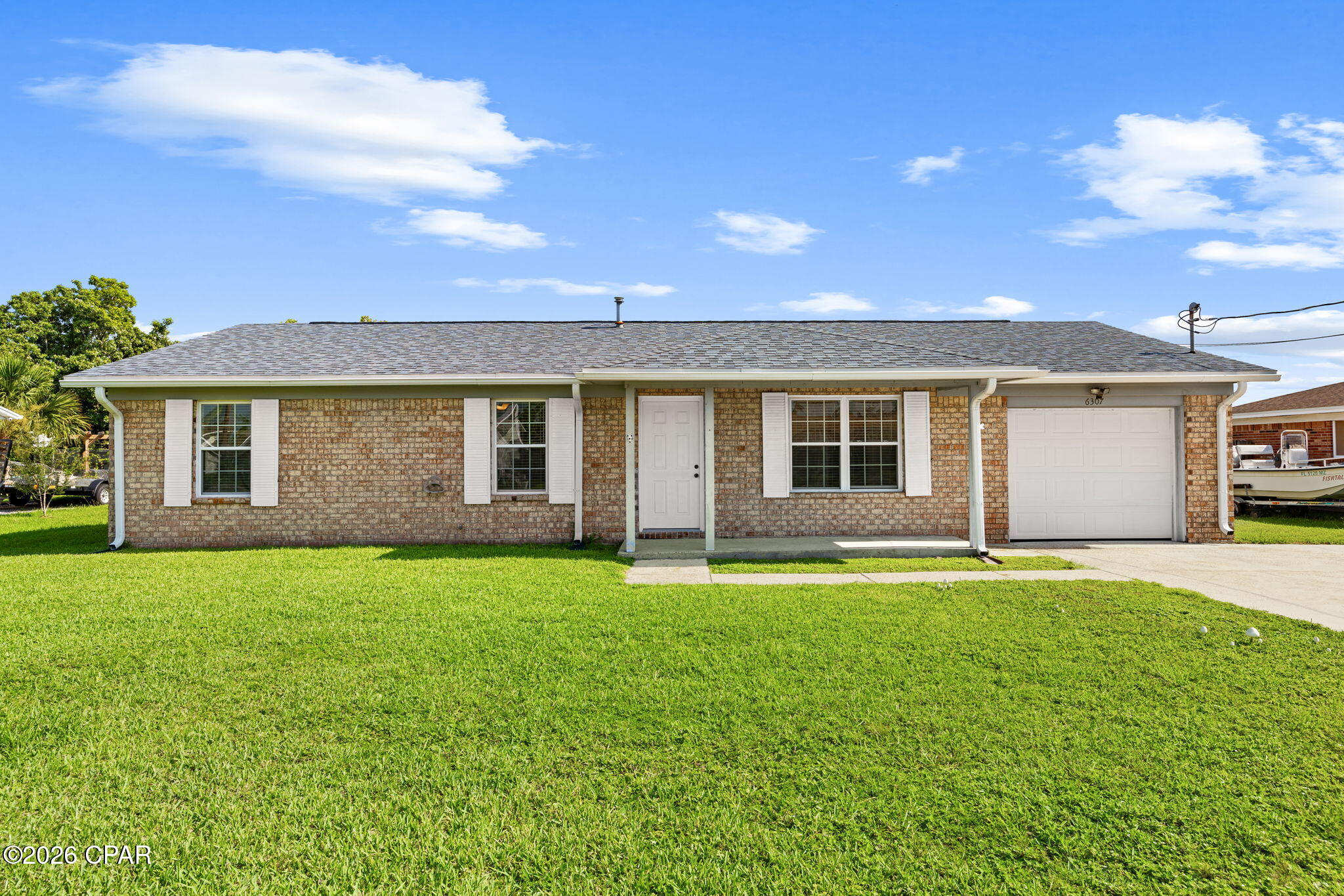 Welcome to 6307 Babby Lane, a move-in-ready 3-bedroom, 2-bath home offering approximately 1,564 heated and cooled square feet on a spacious 0.23-acre lot. 

Inside, the inviting living area features beautiful exposed wood ceiling beams and opens to the kitchen, creating a comfortable flow for everyday living and entertaining. The kitchen features granite countertops, while both bathrooms have coordinating granite countertops for a cohesive look throughout the home. Just off the kitchen and living area is a spacious heated and cooled Florida room offering approximately 288 square feet of additional living space, perfect for a second living area, home office, playroom, or flex space.

Recent improvements include brand-new carpet in all three bedrooms, a new garbage disposal, a new refrigerator, and fresh interior paint throughout in Sherwin-Williams Greek Villa. The doors, trim, and ceilings have also been freshly painted. Major updates include a roof replaced in February 2019 with 30-year dimensional shingles, HVAC installed in September 2019, and a water heater installed in February 2024.

Outside, the spacious backyard is enclosed by a privacy fence and features double-gate access on both sides of the home, providing convenient access to the backyard. A large storage shed offers plenty of room for tools and outdoor equipment. The property also includes a one-car garage with epoxy flooring.

With this convenient location, you're less than 10 minutes from Tyndall Air Force Base, Walmart, and a variety of restaurants, shopping, and everyday conveniences. Previously rented for $1,695 per month, this home offers versatility for an investor looking to add to a rental portfolio or an owner-occupant searching for a move-in-ready property. With approximately 1,564 heated and cooled square feet, numerous recent improvements, and a fully fenced backyard, 6307 Babby Lane is ready for its next chapter.