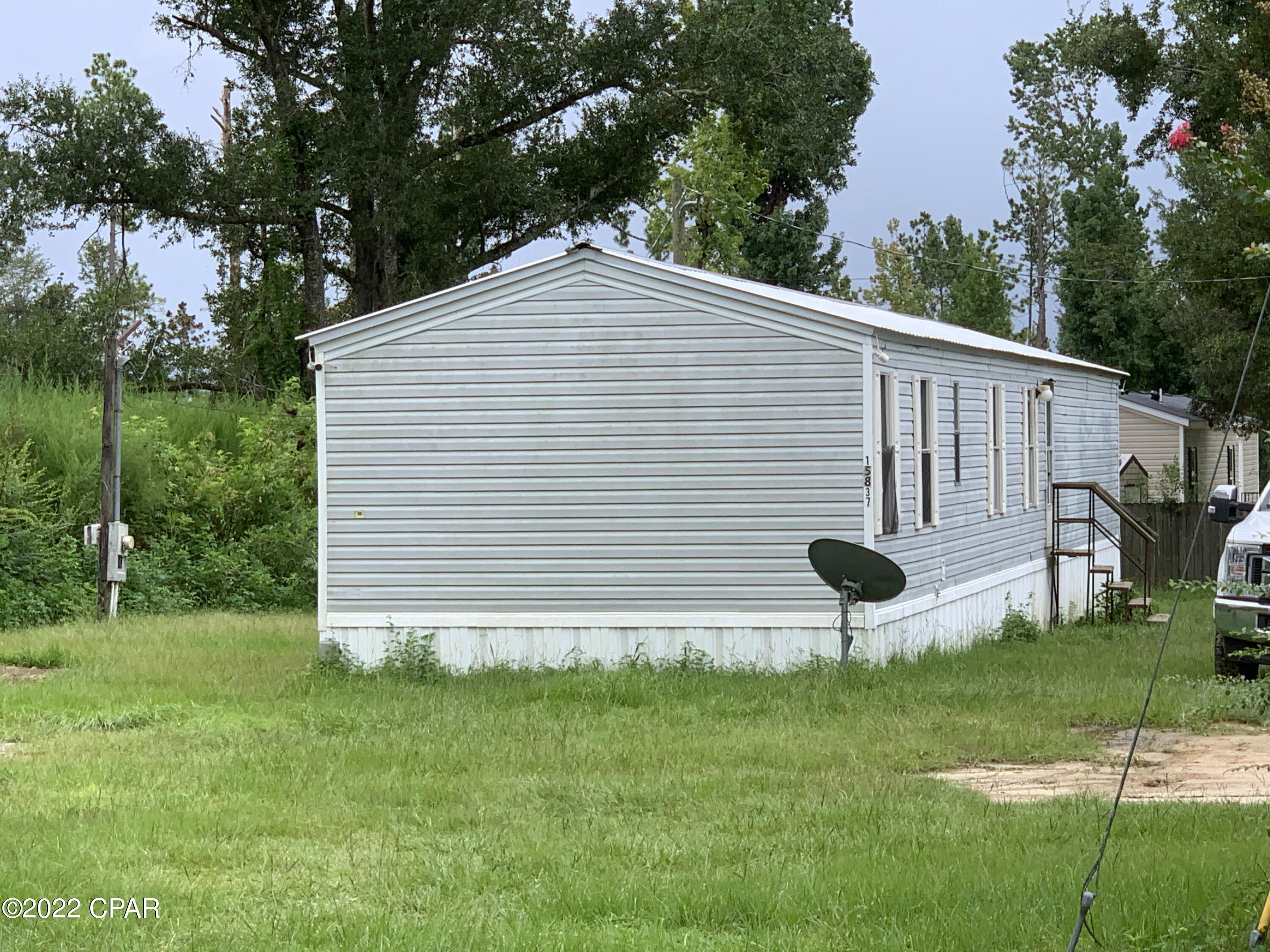 3BR/2BA Mobile Home, conveniently located just outside of Blountstown.  Interior is primed and ready for new paint, floor coverings, and cabinets.  Tons of possibilities.  Great Rental!  Call today to take a look at this fixer upper.  Won't last long.  Property is being sold as-is.  Owner holds an active Florida Real Estate License.