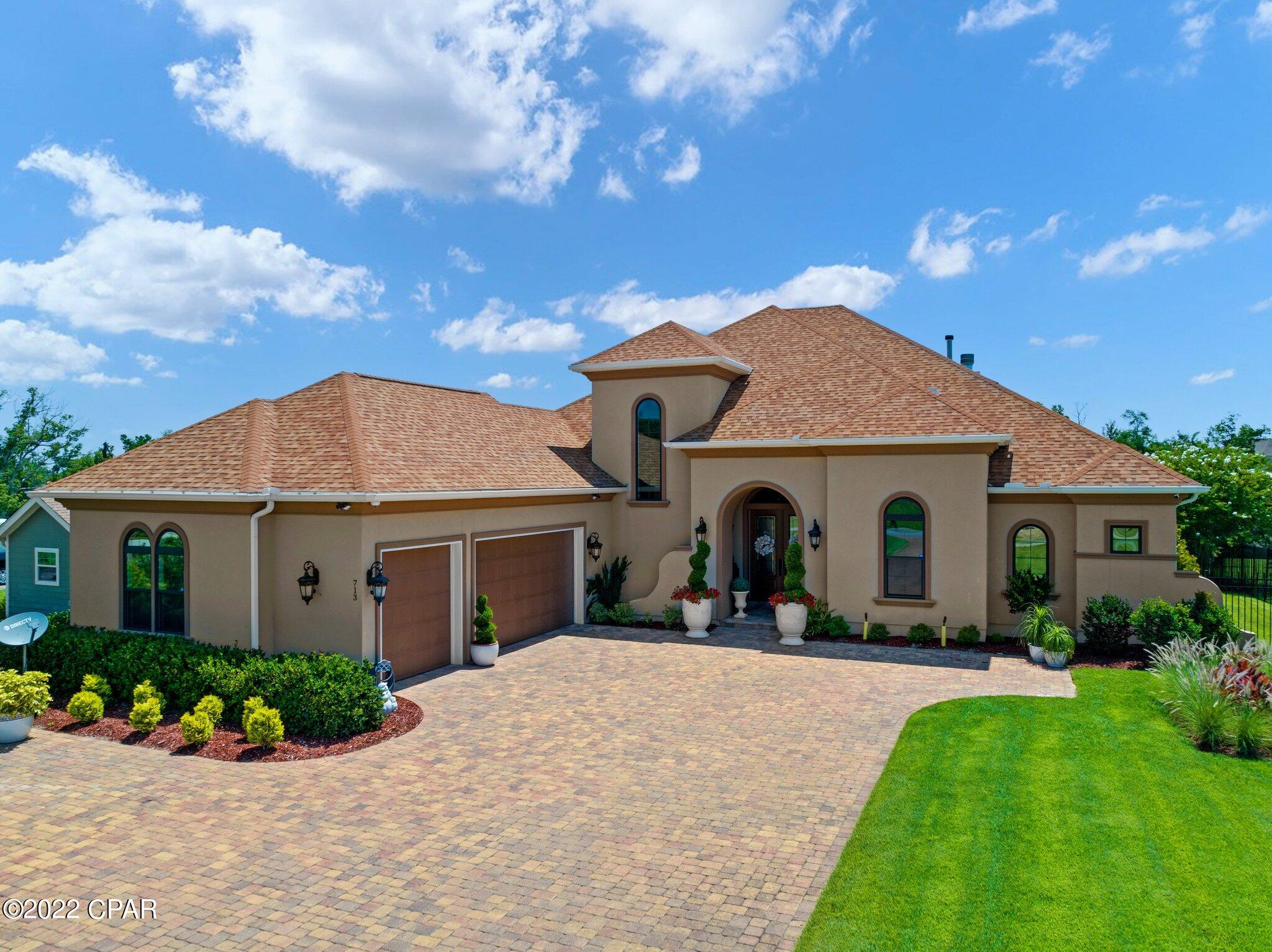 Exquisite near new custom Arthur Rutenberg designed/built waterfront home abounding with relaxed coastal elegance. All top appliances (Wolf gas stove SubZero Fridge etc). ADT security. Trayed ceilings, designer lighting, fixtures and niches, wetbar area w/wine chiller, 2 fireplaces. 3 BR's now, but 4BR options include office, exercise room, big uptairs bonus room suite with full bath . 3 car garage w/ Ninja custom floor. Slider hide-away glass doors open up to screened outdoor living lanai(s) w/FP overlooking heated pool w/extra paver decking. Seawall and boathouse w/remote control lift that now handles 24' boat. This exceptionally decorated and extremely well kept beautiful home is a must see - with tons of additional features to be appreciated. Near 4200 square feet of custom yet casual and inviting "open" coastal living on natural waterway leading to North Bay and Gulf of Mexico. A five minute drive to Panama Country Club (golf course and waterfront clubhouse with grill/bar dining - by separate membership). Only minutes to downtown Panama City, near leisure lovely Lynn Haven, and easy travel to white sandy beaches of Gulf of Mexico by car or boat.