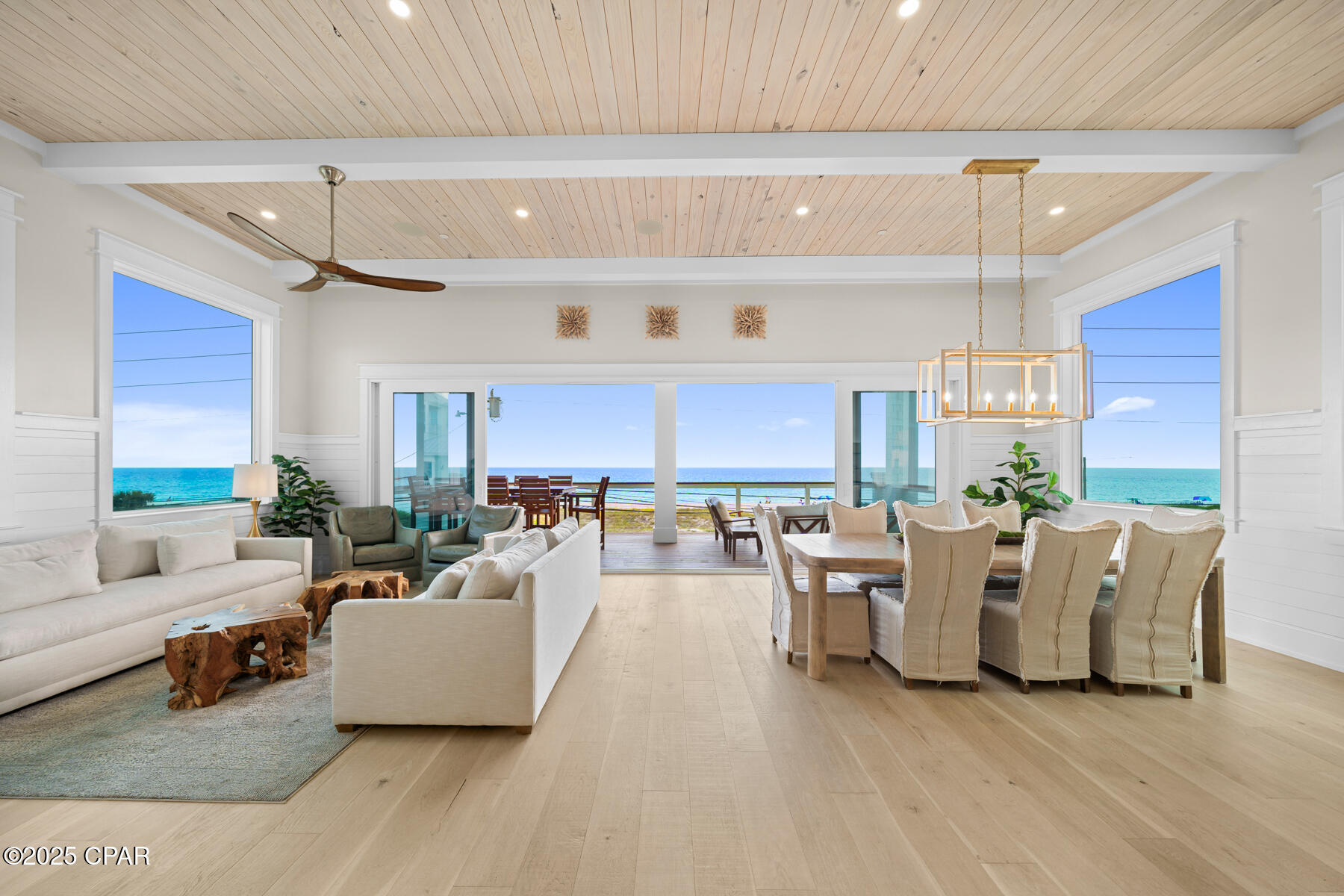 This brand-new fully furnished modern coastal home offers unobstructed, panoramic Gulf views that will never be compromised. Located just steps from the sand, the property features 6,657 square feet of indoor and outdoor living spaces, including 4,497 square feet of heated and cooled interiors, with 8 bedrooms and 7.5 bathrooms. Expansive decks on every floor and multiple indoor and outdoor entertaining areas make the most of the incredible setting.

The resort-style outdoor space includes a pool, hot tub, fire pit, outdoor kitchen, and pool cabana - all designed for hosting large gatherings. Inside, the chef's kitchen is equipped with WOLF appliances and opens to spacious dining and living areas, ideal for entertaining.

With accommodations for up to 28 guests, this fully furnished property is move-in ready and an exceptional investment opportunity for luxury vacation rentals or a private retreat. Enjoy the best of both worlds with a prime Panama City Beach location less than 10 minutes from both 30A and Pier Park.