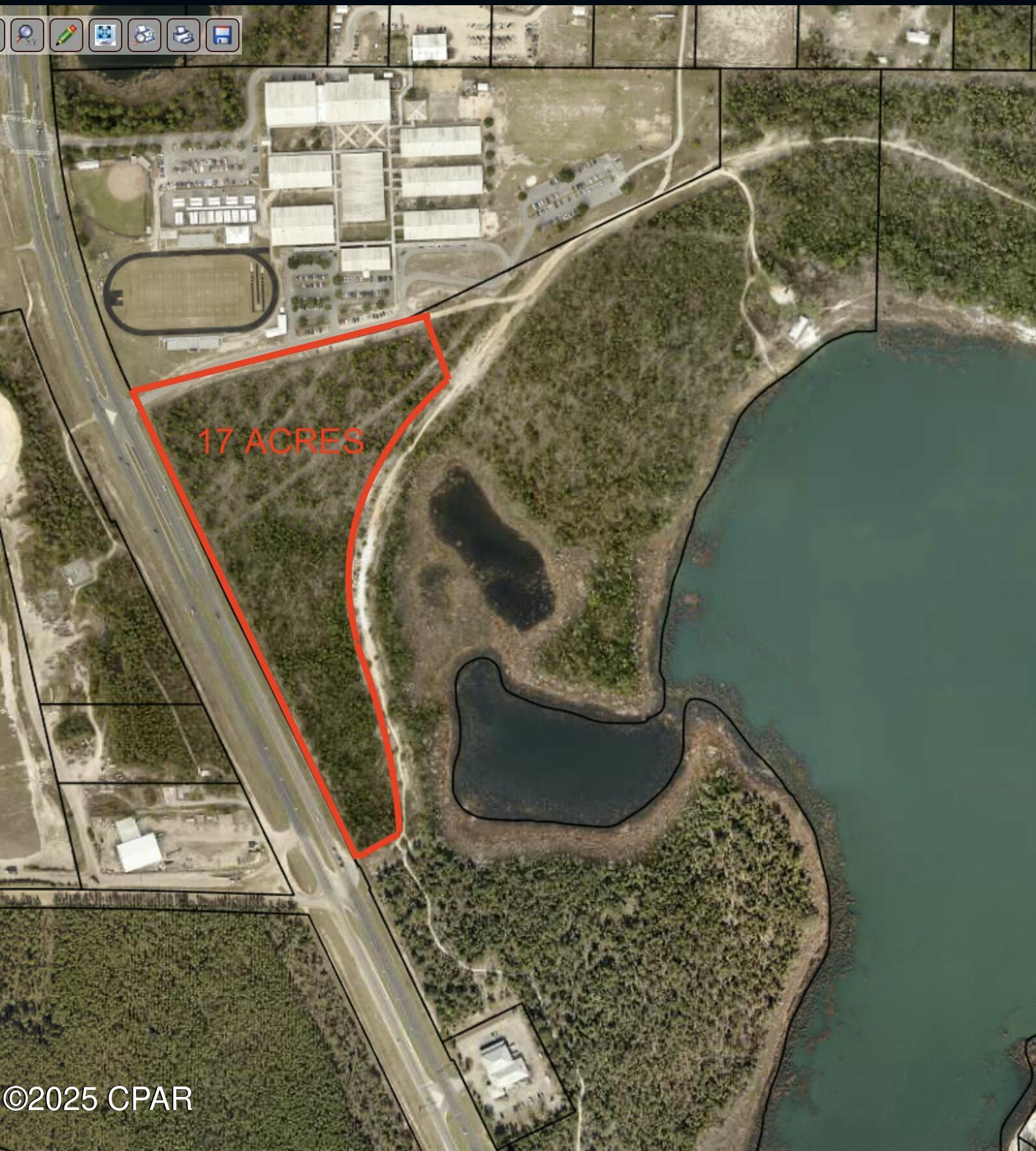 17 Acre C-3 General Commercial Parcel with 1,600 feet on Hwy 77 Frontage and 900' of School Road Frontage. No Wetlands. 10' Water line and Sewer Force Main along the Hwy. Property is Very High and Dry with no wetlands. Ideal for Shopping Center. Property is bordered by an expanding 1,800 student School and the 2,000 acre Lake Merial Neighborhood. Property is part of a larger 100 acre commercial parcel, larger and smaller parcels are available.