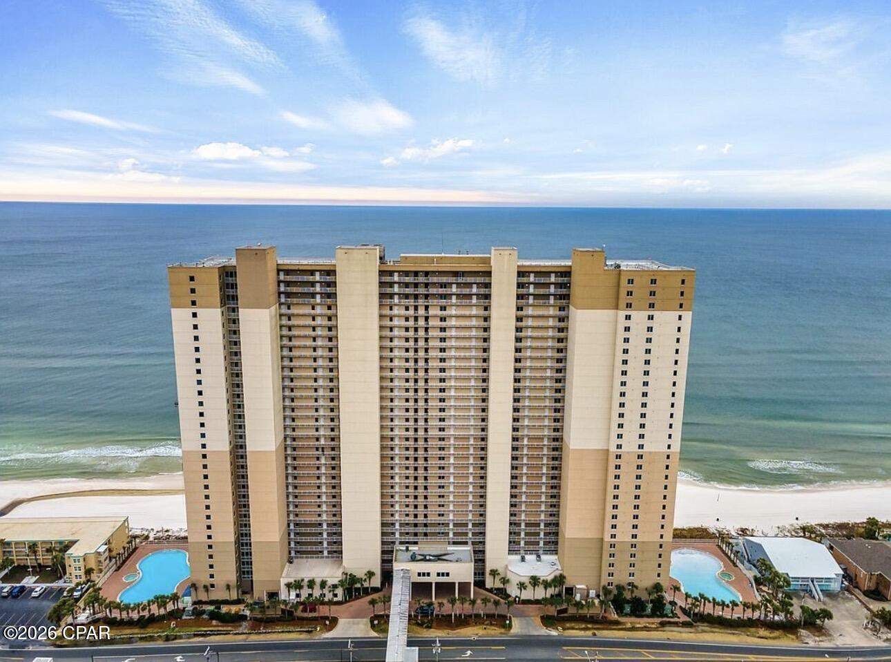 Welcome to Unit 1306 at Tidewater Beach Resort -- a beautifully furnished beachfront condo offering breathtaking Gulf views and an unbeatable location on the highly sought-after west end of Panama City Beach. This spacious and rental-ready condo comfortably sleeps 6 and features an open-concept layout, hallway bunks, two full bathrooms, and a private balcony perfect for enjoying unforgettable sunsets over the emerald waters.

Whether you're searching for a turnkey investment property, vacation getaway, or personal beachfront retreat, this unit checks every box. Located just minutes from Pier Park, dining, shopping, and entertainment, Tidewater is one of Panama City Beach's premier gulf-front resorts with exceptional amenities for owners and guests alike.

Tidewater Beach Resort amenities include:
• 636 feet of private beach frontage
• Two large lagoon-style Gulf-front pools
• Heated indoor pool
• Multiple hot tubs
• Sauna and steam room
• Large beachfront fitness center with Gulf views
• On-site restaurant and tiki bar
• Starbucks and convenience market
• Movie theater
• Arcade/game room
• Owners lounge and conference center
• Covered, gated parking garage with enclosed walkover
• 24-hour security
• BBQ grilling areas
• High-speed elevators
• Wi-Fi throughout the resort

Enjoy strong rental potential, resort-style living, and direct access to the sugar-white sands of Panama City Beach -- all from your own piece of paradise at Tidewater Beach Resort.