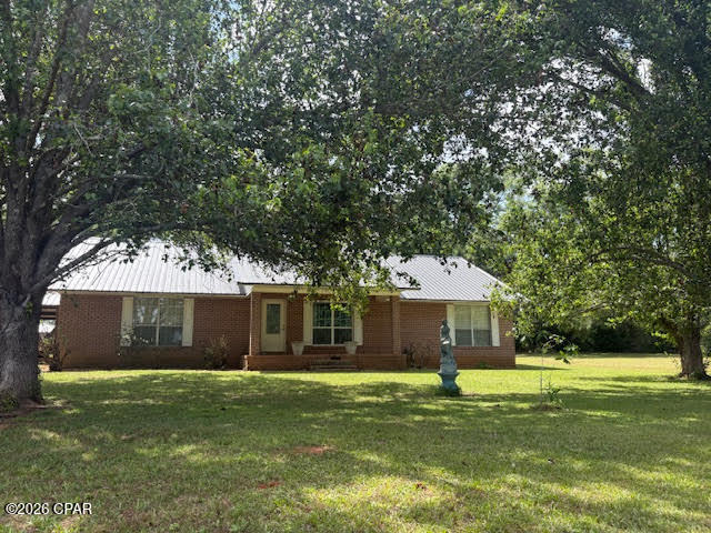 Exceptional multi-family horse farm estate on 20 acres offering versatility, income potential, and endless possibilities. The main residence is a 3BR/2BA brick home featuring a split-bedroom floor plan and over 2,200 sq ft of living space. Recent updates include new appliances (2025), HVAC, and water heater, with metal roofs replaced in 2019. Kitchen includes a gas stove that can be converted back to electric if desired.
The property is fully equipped for agricultural or business use with 4 septic systems and 2 wells. Step outside to a stunning 36x20 custom covered koi pond (3,000 gallons) with dual waterfalls--perfect for relaxing and entertaining.
Equestrian facilities include a 40x100 horse barn with 7 stalls, tack room, feed room, and bathroom, plus an attached powered workshop/storage area and additional open shop space. A 19x73 lean-to houses a sawmill (negotiable). The land is fully fenced and cross-fenced into 5 pastures, all with water access, plus 2 chicken coops. Additional structures include a 20x12 metal building (office) with power and phone, and a 12x36 pole barn with RV hookups. The property is beautifully landscaped with mature oaks and a variety of fruit trees including peach, apricot, apple, pear, fig, chestnut, mulberry, and banana.  Also included is a 2007 double-wide mobile home (4BR/2BA, 2,200+ sq ft) with split floor plan, wood-burning fireplace, and spacious kitchen/dining combo. This home sits on its own 10.33-acre parcel and may be purchased separately. An additional 2006 single-wide (3BR/2BA, 1,100+ sq ft) is negotiable and can remain or be removed prior to closing.
Prime location on Hwy 231 (4-lane) with easy access north to Montgomery and south to Panama City, and just across from Hwy 73 into Marianna. Ideal for a family compound, horse boarding operation, or commercial venture.