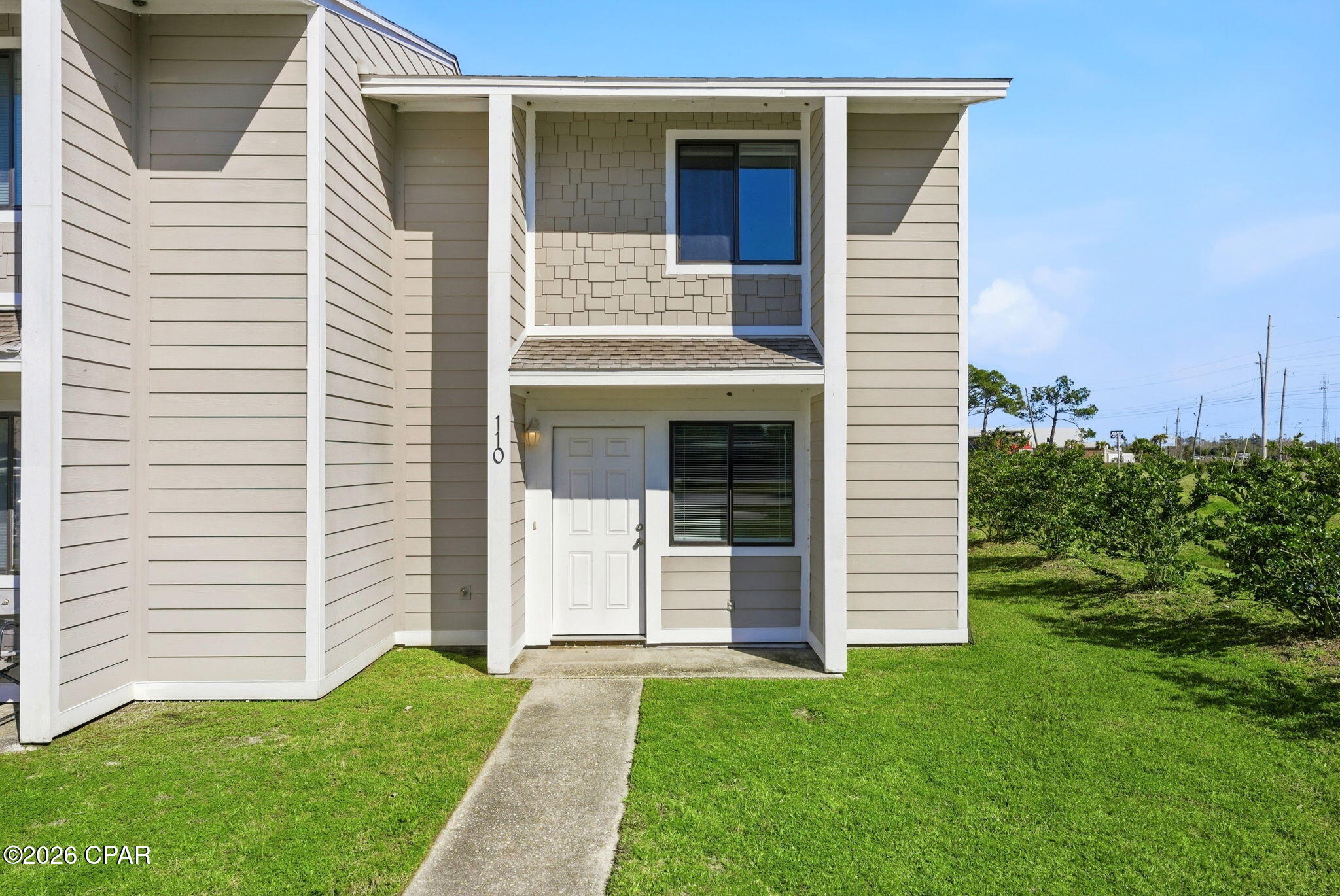 Welcome to 110 Cheri Lane, a well-maintained 2-bedroom, 1.5-bath townhouse located in a conveniently situated quadplex near Tyndall Air Force Base. Offering approximately 972 square feet of living space, this unit features a functional two-story layout with a comfortable living area downstairs and private bedrooms upstairs. A convenient half bath is located on the main level, while both bedrooms share a full bath upstairs. Located in a quiet setting with easy access to shopping, dining, and major roadways, this townhouse is a great option for those seeking an affordable and practical rental.