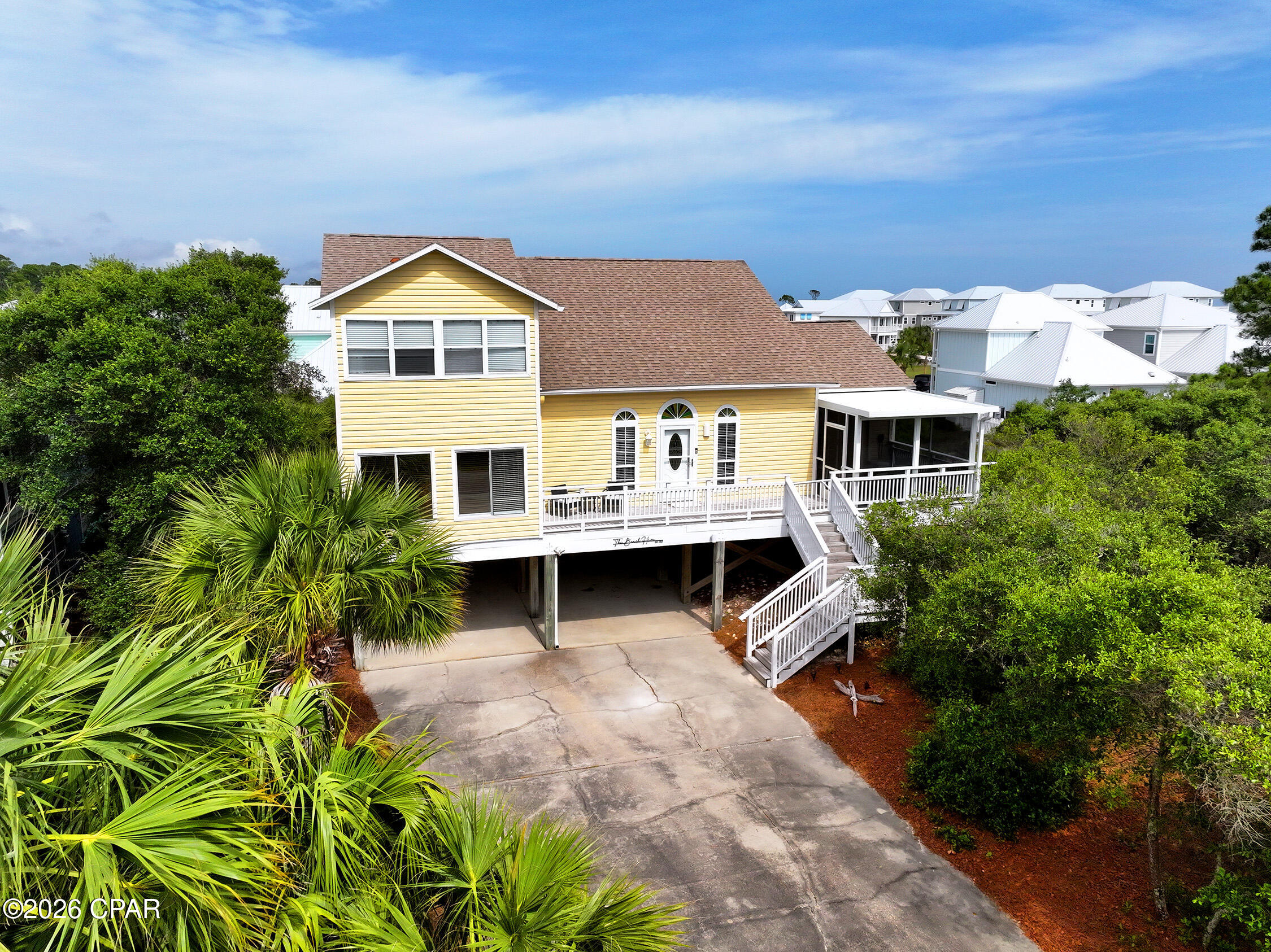 A COASTAL RETREAT that promises to elevate your lifestyle. This luxurious 4-bedroom, 3-bathroom residence is more than meets the eye, offering a unique divided bedroom floor plan that provides privacy and versatility for large families. With a total of 6 rooms/areas available for sleeping, this home is perfect for accommodating guests and loved ones. Step inside to discover an open floor plan adorned with opulent finishes. The living and dining areas flow seamlessly into a chef's kitchen, where stainless steel appliances (including a new stove/double oven), pristine quartz countertops, and an elegant backsplash await your culinary creations. The expansive center island serves as both a functional workspace and a breakfast bar, ideal for casual dining and entertaining. Outdoor living is a delight with a covered front porch and ample deck space, perfect for grilling and relaxation. You'll find convenient storage for all your beach gear, which is included with the home. This property is not only a dream home but also an income-producing opportunity, making it an outstanding vacation destination or investment. With easy beach access and a community pool just a few minute walk away, your coastal adventures await. Engage in kayaking, fishing, seashell hunting, and wildlife spotting right from your doorstep. Nearby Salinas Park offers additional recreation with pickleball courts, horseback riding, and miles of paved walking and bike trails. With tons of parking, including boat parking and a large driveway, this home is ready to accommodate all your needs.