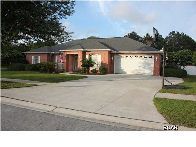 If you are looking for a spacious home centrally located on a quiet street in a great neighborhood, you've found it!  To top it off, cool off on hot summer days in the beautiful community pool just a short walk away.  Located on a large corner lot in The Hammocks, this custom built house features a split floorplan with a massive great room and some of the largest bedrooms you will find.  The office off the foyer can be used as a 4th bedroom if desired. Once you enter the tiled foyer w/crown molding you will feel at home. The spacious dining room to your right has plenty of room for all your dining room furniture. Straight ahead is the great room with plenty of room to relax with family or entertain.  It features a cathedral ceiling, a gas fireplace (that has a lovely mantel)