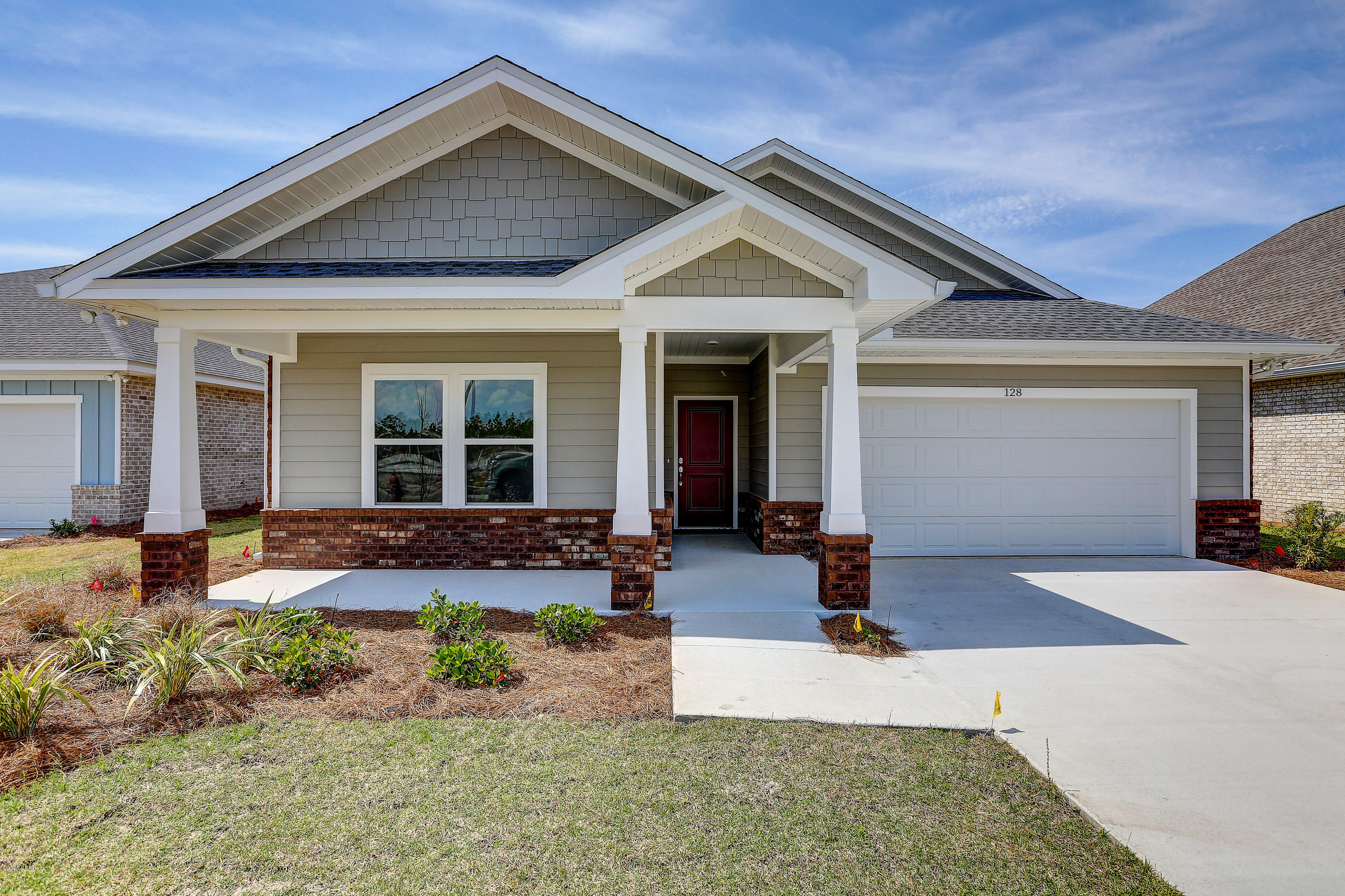 NEW CONSTRUCTION, CAMRYN'S CROSSING II subdivision in Lynn Haven built by Southern Coastal Homes. Interior features if the 4 bedroom home include a large living room that is open to the kitchen and dining area. Kitchen has a large center island, subway tile backsplash, and stainless appliances. French doors lead from the Great room to the large covered patio. Master suite has tray ceiling, double vanity, garden tub, and walk-in closet. This home includes features of the DESIGN BOARD shown in the photos. Cam II offers walking park & playground.



EXTERIOR - This all brick home has a 2-car garage, large covered lanai, covered front porch, fully sodded yard with Rain Bird sprinkler system.