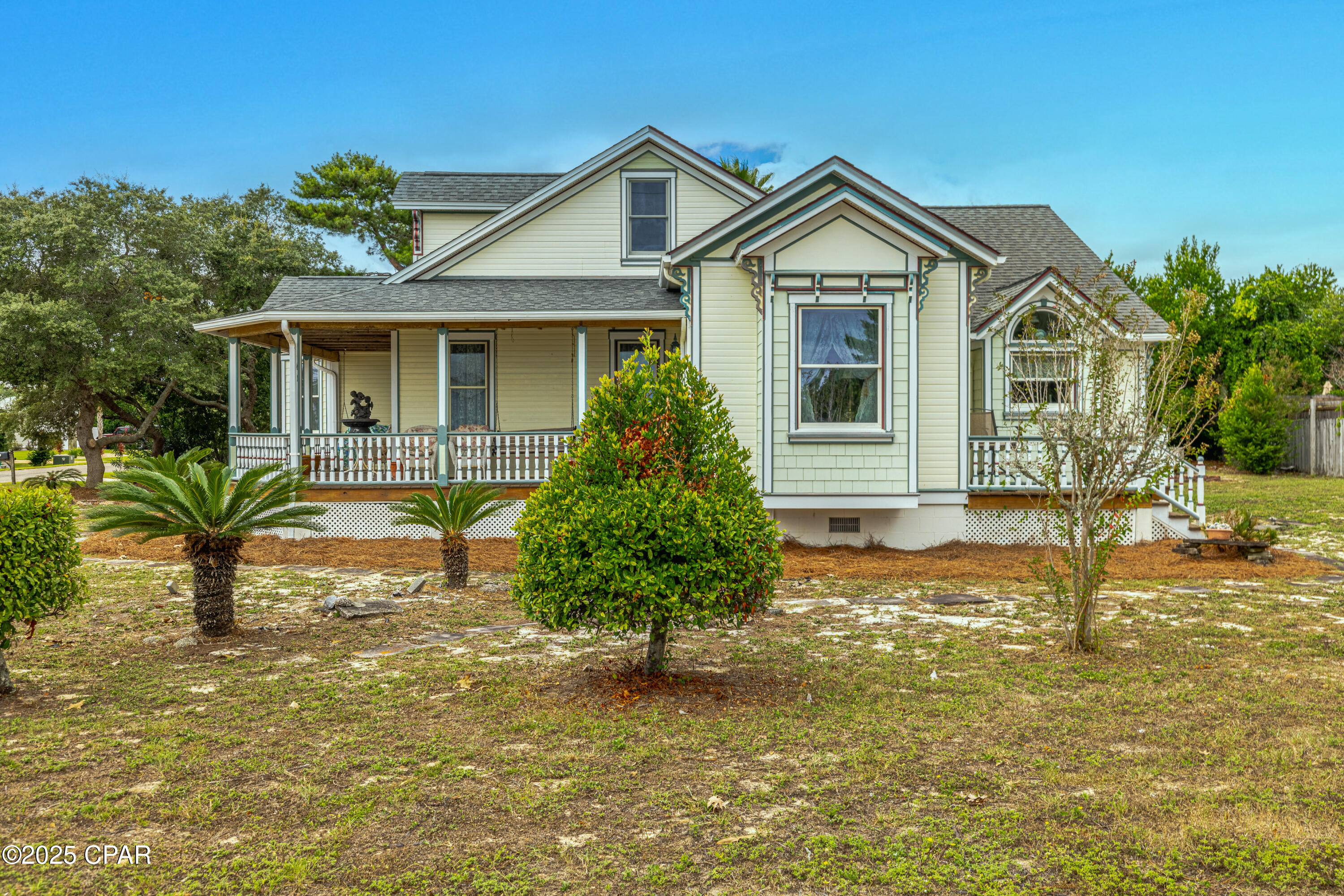 Charming Victorian at the Beach - 
Step into this unique Victorian-style home situated on a very large corner lot just blocks from the beach. With its classic wrap-around porch and timeless details, this home is filled with warmth, character, and plenty of space for making memories.
Inside, you will find 10-foot ceilings, solid wood doors, and bright, open rooms that feel both comfortable and inviting. The kitchen features custom cabinets and shelving, beautiful granite countertops, a Jenn Air downdraft range, and an extra gas cooktop—perfect for preparing meals to share with family and friends.
Upstairs, a 260sqft bonus room with half bath offers flexible space for guests, hobbies, or a cozy retreat. Everyday living is kept easy with thoughtful features like a geo-thermal heating and cooling system, an 1100sqft, 3-car garage with workshop, and a laundry area with shower - a welcome convenience after beach days. The home's living space can also be expanded into the garage, offering you endless options for the future.
Step outside to enjoy a 316 sq. ft. wrap-around porch and a 144 sq. ft. deck, perfect for morning coffee, breezes, and sunset gatherings.
This is also a prime investment / short-term rental location. Blocks from the beach and just 10 minutes from Pier Park with its endless shopping, dining, and entertainment, and only 5 minutes to scenic 30A and South Walton's upscale dining, boutique shopping, and nightlife, you'll be at the center of everything the coast has to offer.