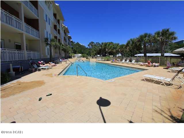 This is not your average Mexico Beach condo. This 3rd floor corner unit, with slight gulf view, is very spacious with 2 master BRs & 3 full BAs. Open floorplan with the living/kitchen/dining area opening up to a very long deck overlooking the canal & just down from the pool. This home has never been a rental & is in fantastic shape. Being sold completely furnished as shown, move in ready. Waterside Village is located on the Mexico Beach canal & a short walk to the beach. You can tie your boat up to one of the many docking areas & be in the Gulf in minutes. The gated Waterside also has the largest & probably nicest pool/hottub/sundeck area in Mexico Beach along with a community grilling area overlooking the canal. This property originally sold for $563K in 2007.