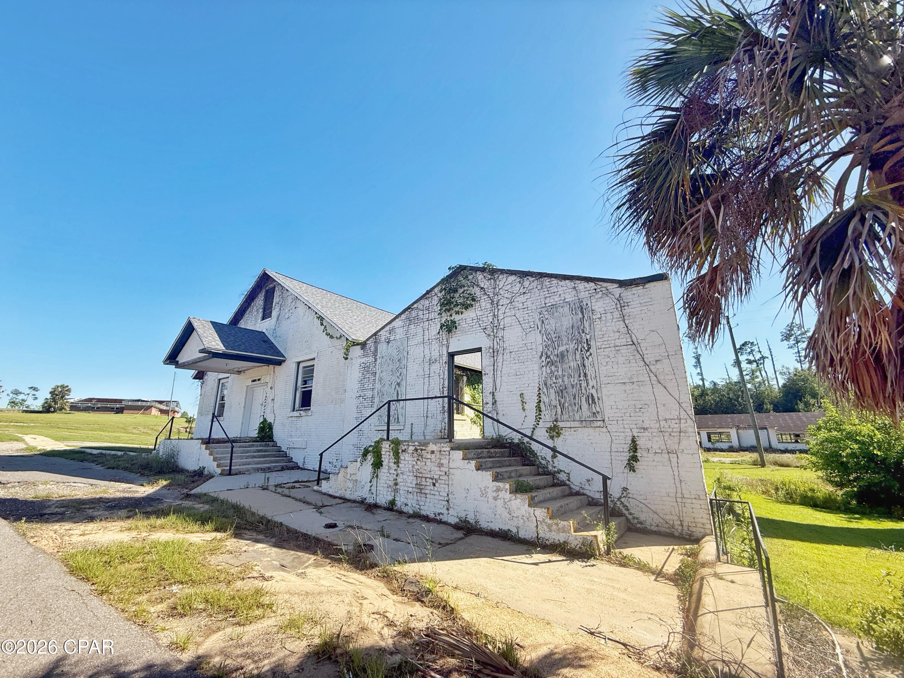 Located within the newly formed Endeavor Park, this 3,600+/- SF historic Carpentry building sits on approximately 0.52 acres MOL presenting an exceptional opportunity for visionaries, entrepreneurs, and investors ready to bring new life to a property full of potential. Zoned commercial and in need of revitalization, this structure offers the chance to reimagine and restore a piece of history while becoming part of one of Marianna's most exciting redevelopment efforts. 

Positioned within the expansive 1,200-acre Endeavor Park, the vision for this transformational area is centered around renewing a historic part of Jackson County into a thriving destination for business, community, and innovation. 

Momentum is already underway, with nearby redevelopment & community investments including the newly opened Jackson County Civic Center directly across the street. 

With its character, location, & commercial zoning, this property would make an incredible antique market, restaurant, brewery, entertainment venue, creative retail concept, or adaptive reuse project. 

Bring your imagination and business ideas to help fulfill the vision for this park and become part of the continued transformation here!