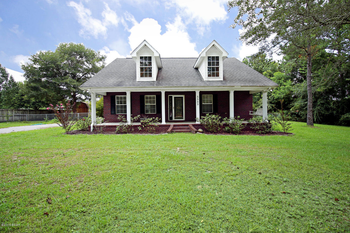 This is a gorgeous home just minutes to town! Home features beautiful flooring, granite counter-tops, a kitchen island, stainless steel appliances, and lots of space! The home features a large front porch and .75 acres of land. Interior also features hardwood vinyl floor, a living room with fireplace and tray ceiling, a big open kitchen with an island, dining area, and lots of natural light! The master bedroom features a tub and separate shower plus a double vanity. Home comes complete with a security system. The exterior features are large shade trees, storage building, and easy access to one of Bay Counties largest recreation parks. Also, all of the bedrooms in this home feature large walk-in closets! **There is also a bonus room featuring 300 Sq Ft of heated and cooled space that is not included in the home's sq ft (access is thru the attic stairs)** Make your appointment to view this beautiful home today! You won't be disappointed!