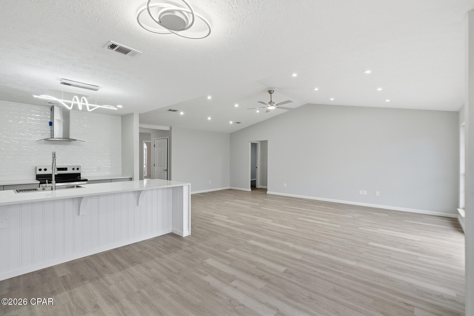 Welcome to this beautifully fully renovated 3-bedroom, 2-bath home in the heart of Lynn Haven, Florida. Thoughtfully updated with modern finishes
and quality upgrades throughout, this move-in ready home offers both comfort and style. Step inside to find durable and stylish luxury vinyl plank (LVP)
flooring flowing seamlessly through the living spaces, complemented by recessed lighting that creates a bright, inviting atmosphere. The updated bathrooms
provide a spa-like experience with heated floors-perfect for added comfort year- round. The kitchen is a show stopper with a waterfall quartz island. The home features major system upgrades for peace of mind, including a new roof (2019), water heater (2020), and brand-new AC unit (2025), ensuring energy efficiency and reliability for years to