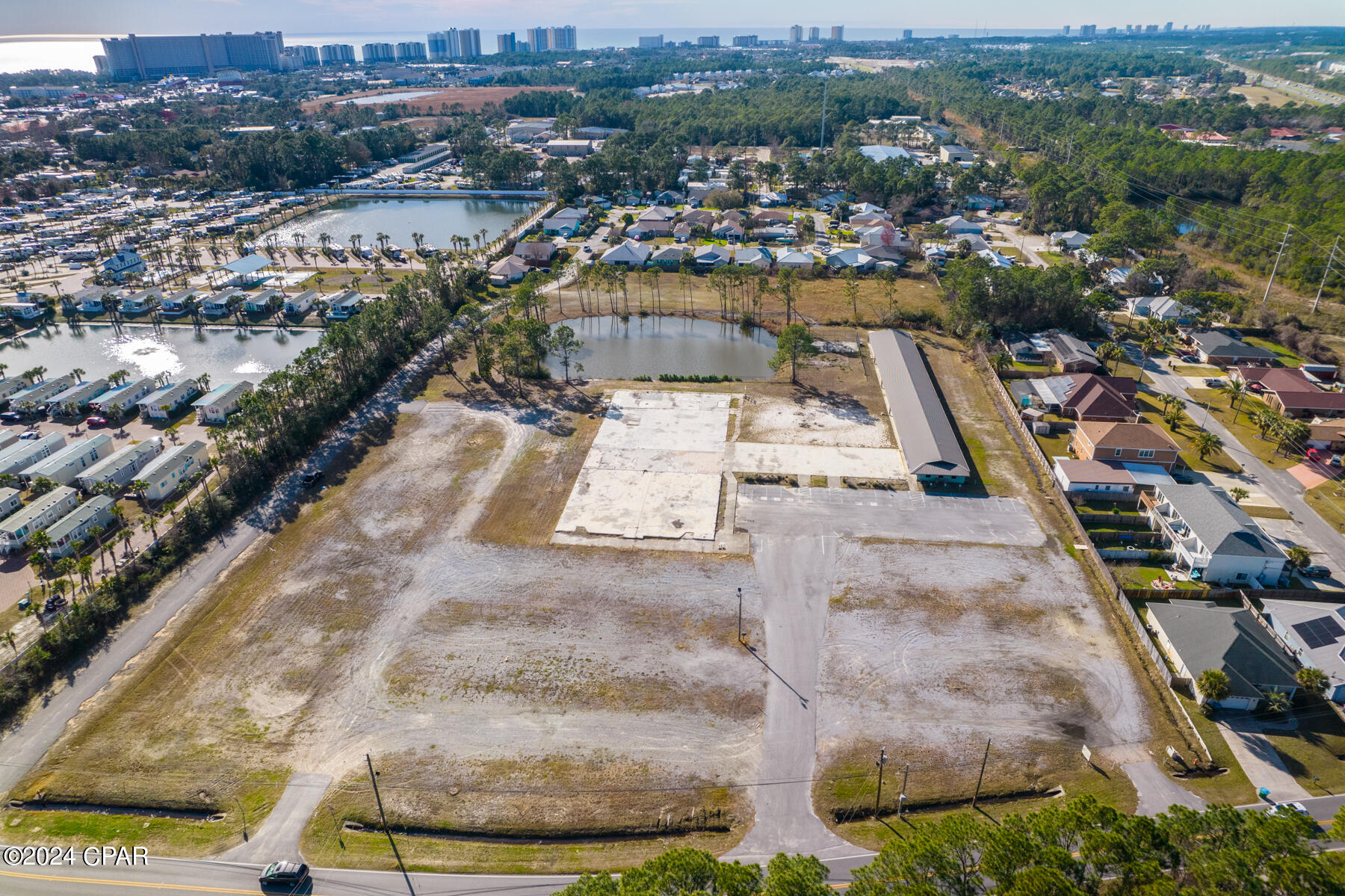 Rare opportunity! This almost 8 acre C-3 zoned property allows for residential use, giving endless potential in a highly flexible zoning category. The property features approximately 400 feet of road frontage, no wetlands, and is served by municipal water and sewer, significantly reducing development risk and timeline.

The site represents a fully entitled commercial development opportunity, positioned along an established corridor with direct connectivity to U.S. Highway 98 (Panama City Beach Parkway). Surrounding zoning includes commercial to the south and residential and public/institutional uses to the north, creating a logical transition location for neighborhood-scale commercial and service development.

Property includes a former church structure and is suitable for a variety of commercial uses permitted under C-3 zoning, subject to site plan approval and County development standards. Buyer to verify all permitted uses, density, and development requirements.