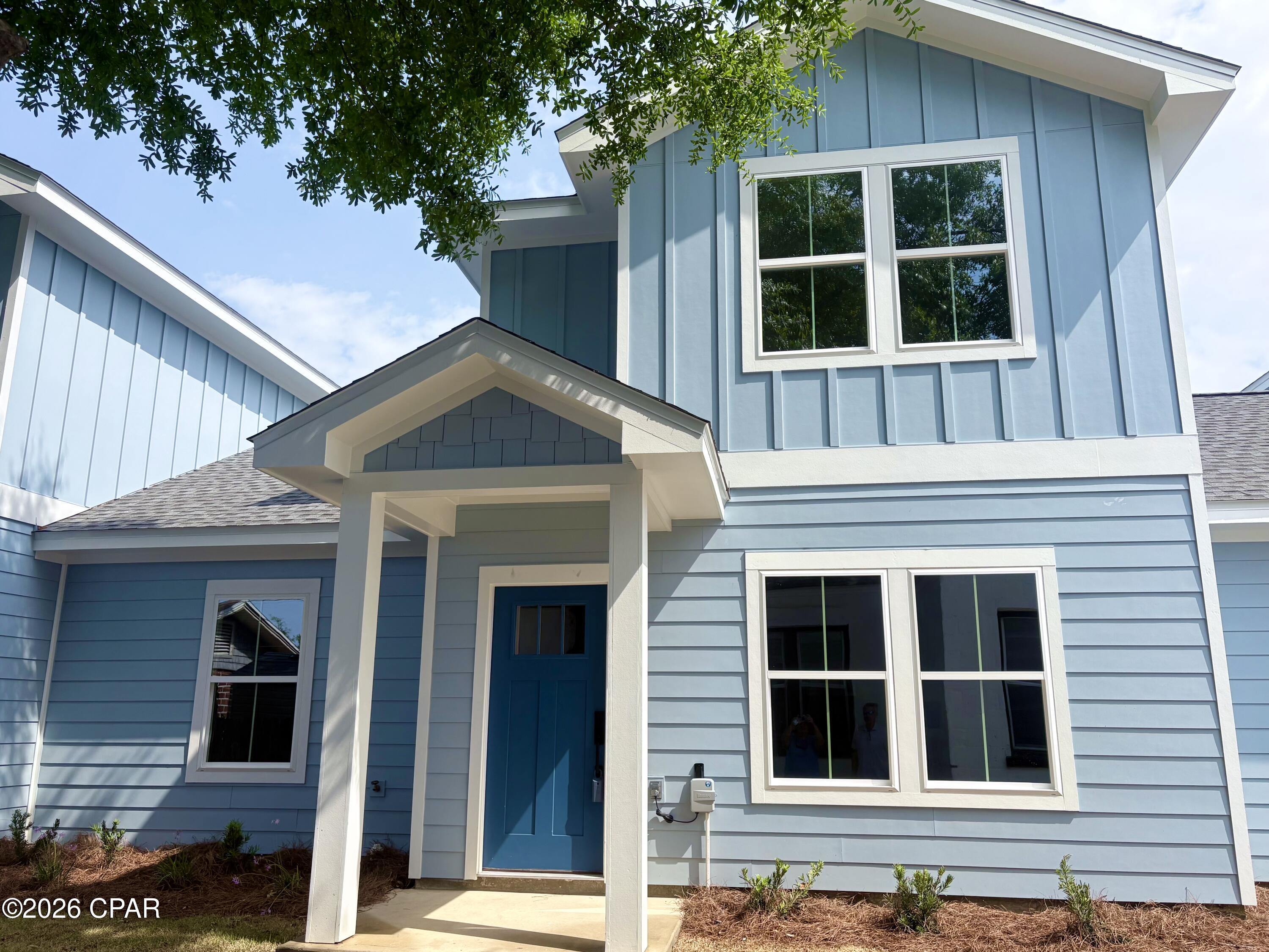 Welcome to this beautifully crafted, newly constructed two-story townhome ideally located just minutes from downtown Panama City. Enjoy convenient access to local restaurants, marina activities, vibrant community events, and a short drive to Tyndall Air Force Base and the stunning beaches of Panama City Beach.

This thoughtfully designed 3-bedroom, 2.5-bath home offers approximately 1,350 square feet of modern living space. The exterior features durable Hardie board siding, a private sidewalk, and a built-in irrigation system for easy maintenance.

Inside, the main level showcases stylish luxury vinyl plank flooring and a convenient half bath. The kitchen is equipped with sleek quartz countertops, ample cabinetry, stainless steel appliances, recessed lighting, a breakfast bar, and a pantry, perfect for both everyday living and entertaining. The open-concept layout seamlessly connects the kitchen, dining, and family areas, creating a bright and inviting space.

The master bedroom is conveniently located on the main floor, offering added privacy. The en-suite bath includes a single vanity, walk-in shower, and tile flooring.

Upstairs, you'll find two additional bedrooms and a full bath, providing comfortable accommodations for family or guests.

Whether you're a first-time homebuyer or seeking a property with strong rental income potential, this townhome presents an excellent opportunity for both primary residence and investment.

Please call if interested in purchasing all 3 townhomes together.

All measurements are approximate and should be verified if important.