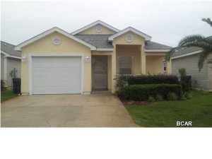 This is a beautiful 3 Bedroom 2 Bath home in immaculate condition one block from the beach -- offered by the original owners, utilized as a winter home and never rented! It is being sold with all furnishings. With upgrades to include: ceramic tile in the entry foyer, kitchen and both bathrooms hurricane window coverings for all windows and French doors to the screened porch. Kitchen area is roomy with a pantry and breakfast bar. A separate dining area is adjacent to the spacious living/family room which overlooks the screened porch. The oversized master bedroom adjoins the large master bathroom with dual vanities, walk-in closet and glass-door walk-in shower. The two additional bedrooms are adjacent to the second full bathroom. The one-car garage has an automatic door opener and