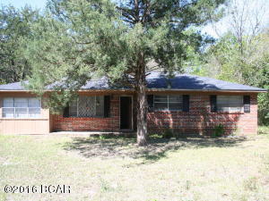 Modest sized brick home on 0.31 ac lot in town of Campbellton, FL. Home has good potential! Has 3 bedrooms and 1 and 1/2 baths. The garage was converted into a den. There is a large utility room that has a half bath. Kitchen is nice size with stove, refrigerator and a dishwasher. Located on a paved street with city water.