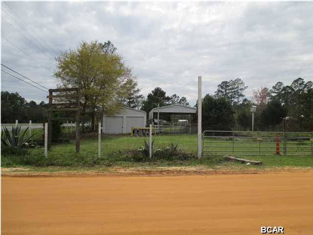 Property has a garage and cover for RV parking and is completely fenced. Dimensions on land are approximate. Exact dimensions will be determined by survey. Would be great place to add a home and home based business.