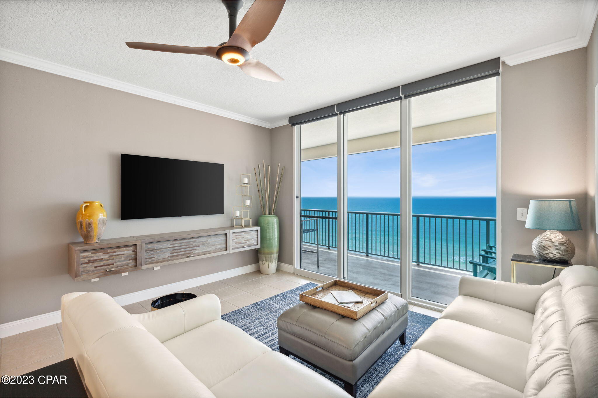 Do not miss this stunning, 3 bed/3 bath Palazzo condo with amazing, high end upgrades!   This unit has higher ceilings and windows than most, which allows for abundant natural light and spectacular views.  The kitchen has new custom cabinets, new state of the art appliances and optimized storage with a custom cabinet pantry including rev-a-shelf inserts.  Double thick granite countertops and a farmhouse sink provide an elegant touch.  A custom bar with beverage center was added, greatly enhancing entertainment possibilities.  Bella Cera luxury wood floors were installed in the bedrooms and the primary bedroom has all new furniture and bedding in addition to stunning gulf views.  Lutron battery electric shades were installed in the primary bedroom as well as the living room.   See more.... The primary bath has been completely remodeled and an oversized, custom tile shower was  installed along with custom vanity and cabinets to increase storage.  The washer/dryer were replaced and installed in the primary bathroom suite with multiple cabinets and a granite folding surface.  All new ceramic tile was installed in the bathroom suite and closet.  All lighting has been upgraded to modern LED fixtures.  The living room was upgraded with a 65" LED TV, floating shelves and all new furniture.  This condo comes with a storage unit.  The Palazzo is located on the quiet, less dense west end of the beach, and is close to Pier Park.  It features a workout center, elevated pool and spa and beautiful lobby area with recent upgrades throughout.  You don't want to miss out on this unique condo.  Call today to see it before it's gone!