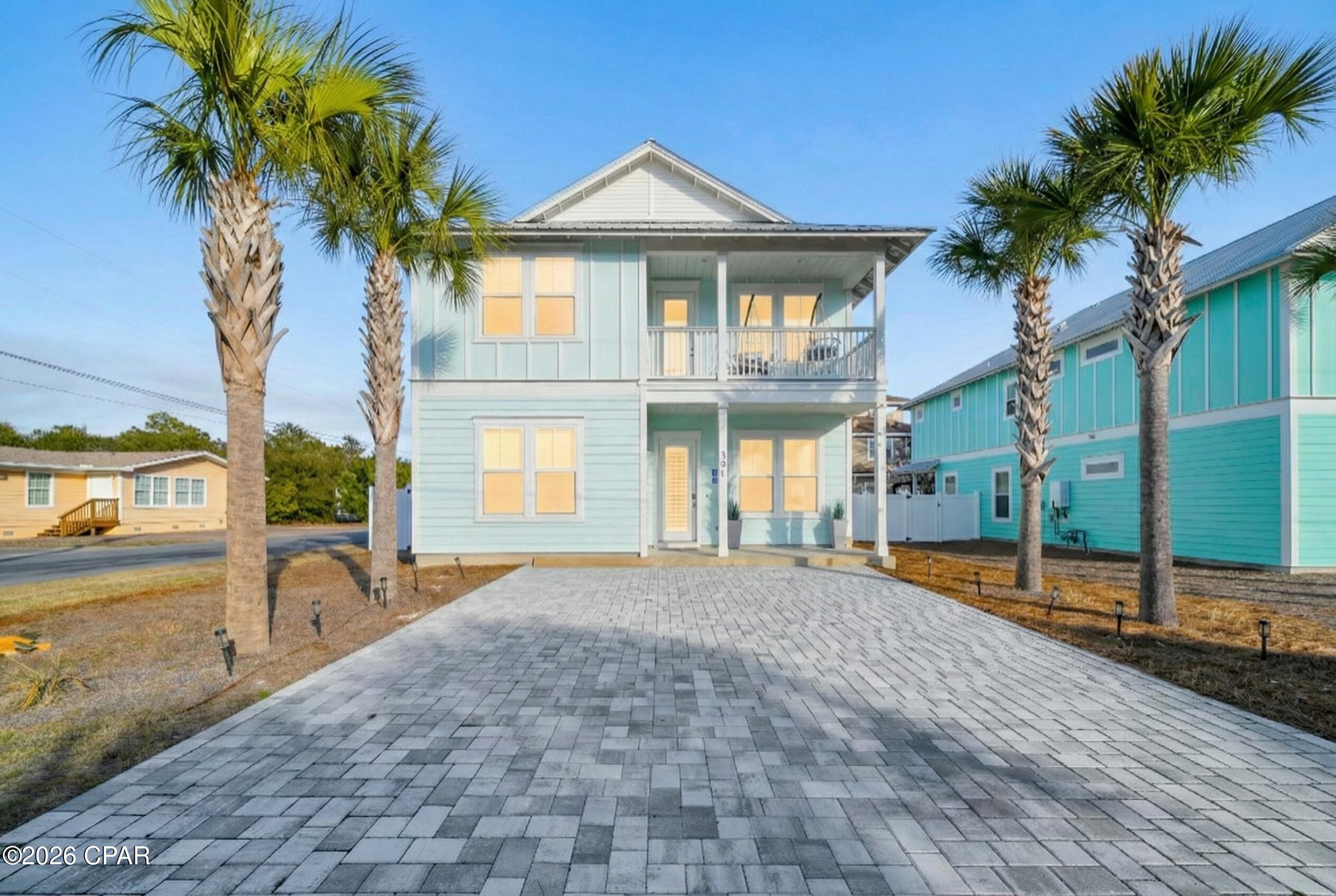 Located just one block from the white sands of Panama City Beach, this luxury 6-bedroom, 4.5-bath residence is a proven income generator currently operating as ''Mighty Seychelles.'' Perfect for the modern vacation market, the home sleeps up to 14 guests and features a dedicated upstairs family game lounge, a chef's kitchen with stainless appliances, and a private, heated saltwater pool. Its prime location south of Hwy 98 puts guests within walking distance of the beach and just a short drive from Pier Park.

For investors seeking a scalable portfolio, this property offers a unique ''mega rental'' opportunity when combined with the adjacent home at 303 Vestavia. The current owner has successfully marketed the pair as a 12-bedroom compound, dominating the lucrative large-group market. Whether purchased individually or as part of a pair, this turnkey home offers impressive history and immediate cash-flow potential.