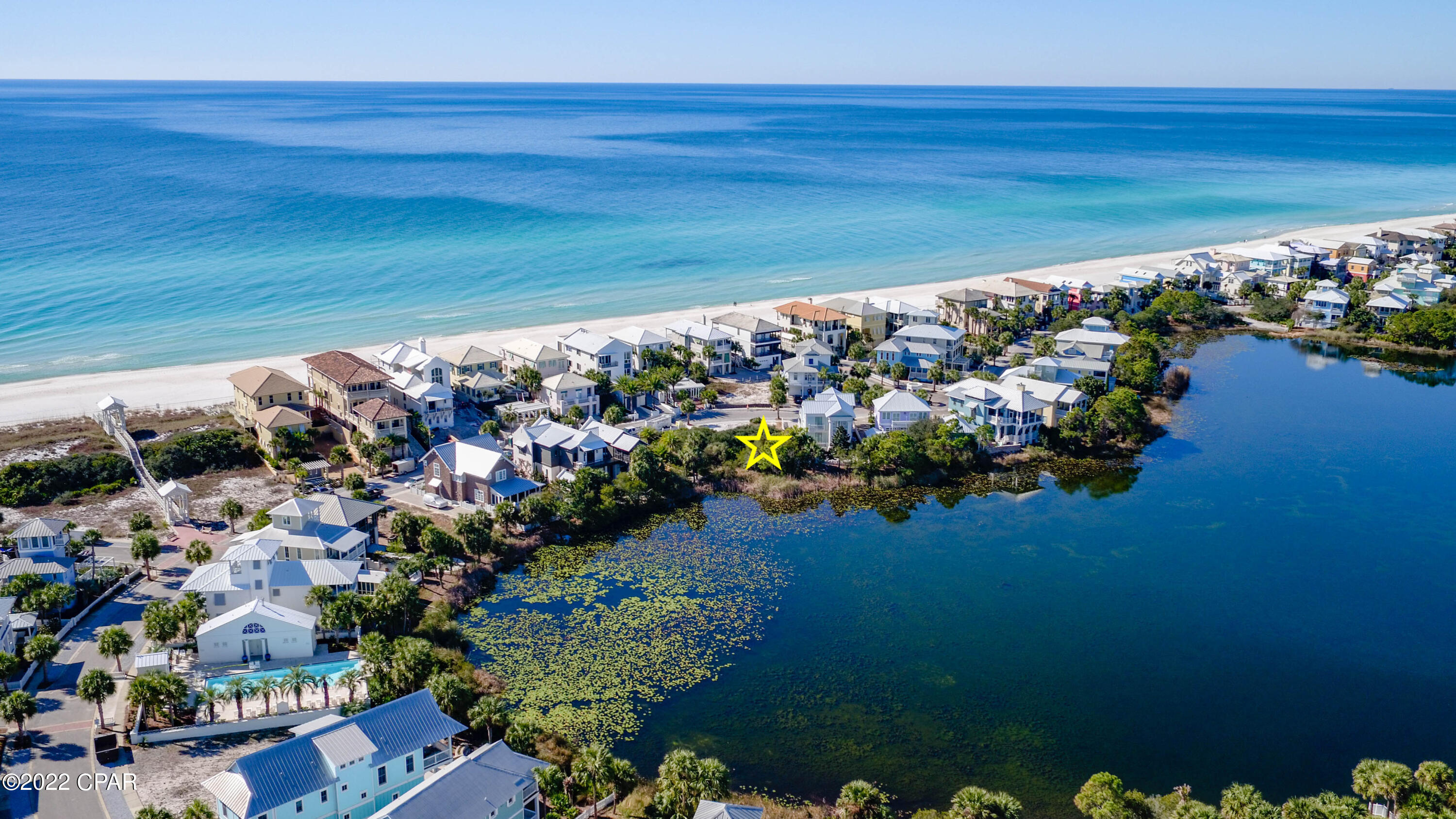 Truly once-in-a-lifetime opportunity to build your dream home in the heart of Carillon Beach.  Two adjacent lots on Lake Carillon with 120' ft. Beachside drive frontage and GULF-VIEWS from your new home.  This is the last opportunity to buy 2 contiguous lots on the lake and across from the gulf.  Building design is subject to Carillon Design Review Committee, but these two premier lots allow for the creation of a main home and guest home totaling about 5500-6000 sqft.   As close as you can get to the gulf, without being ON the gulf and paying premium prices for gulf-front lots and building on the gulf. Space for private pool, though community pool on the gulf is just steps up Beachside Drive.  NOTE:  Both lots are to be sold together.  Buyer to verify all dimensions/building restrictions.